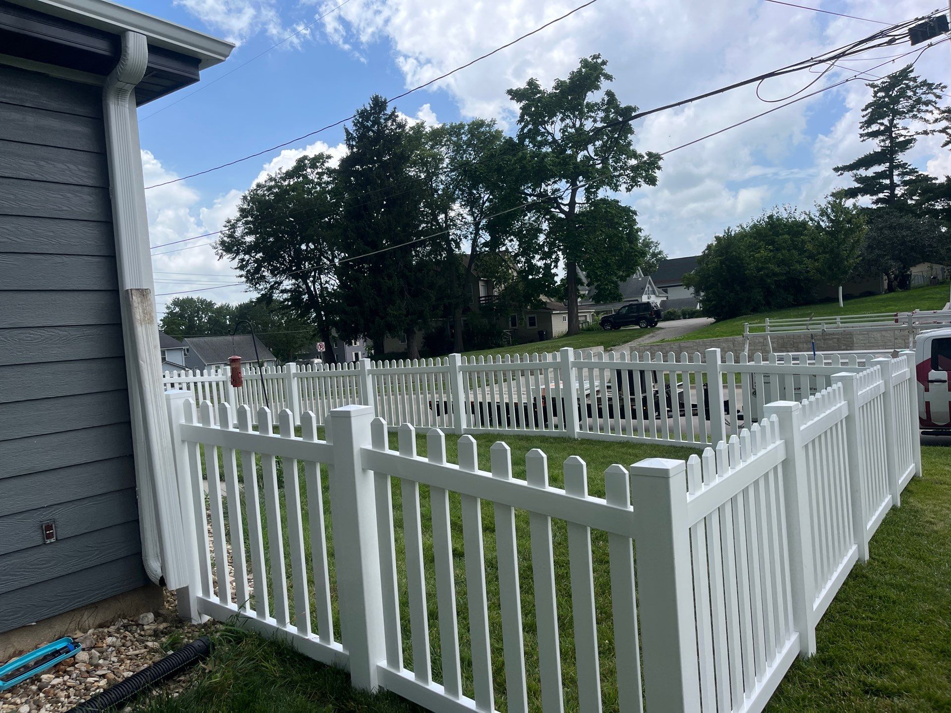 White Vinyl Spaced Picket Fence Installation in Cedar Falls by Perfect Picket Fence and Stain