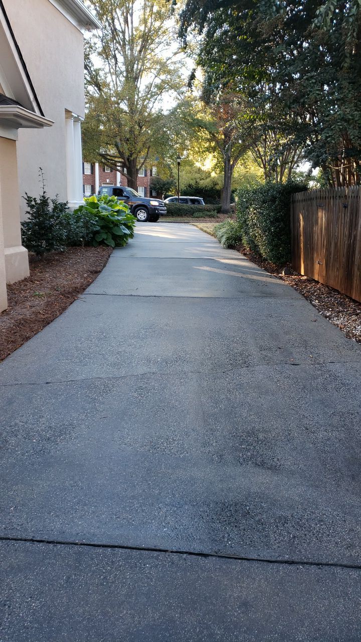 Driveway Clean using cleaner by Power Wash Masters LLC