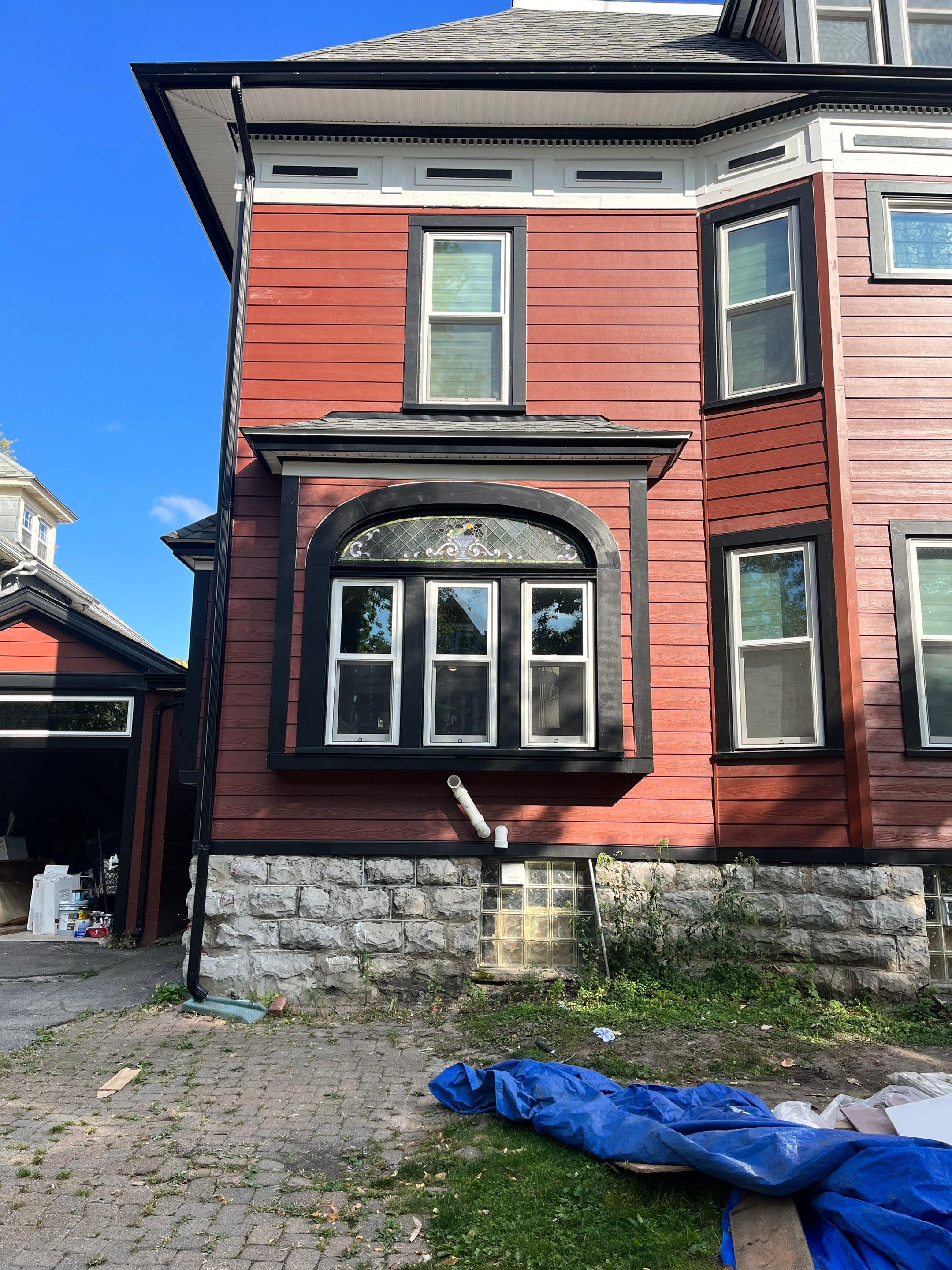 Exterior Renovations- Siding, Stamped Concrete, Porch, and Railings by Ivy Lea Construction