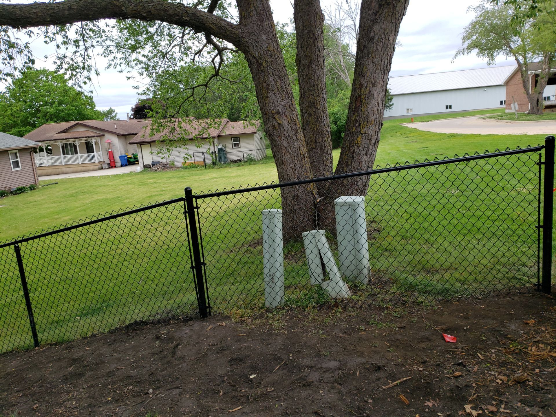 Chain Link and Cedar Privacy in Grundy Center by Perfect Picket Fence and Stain
