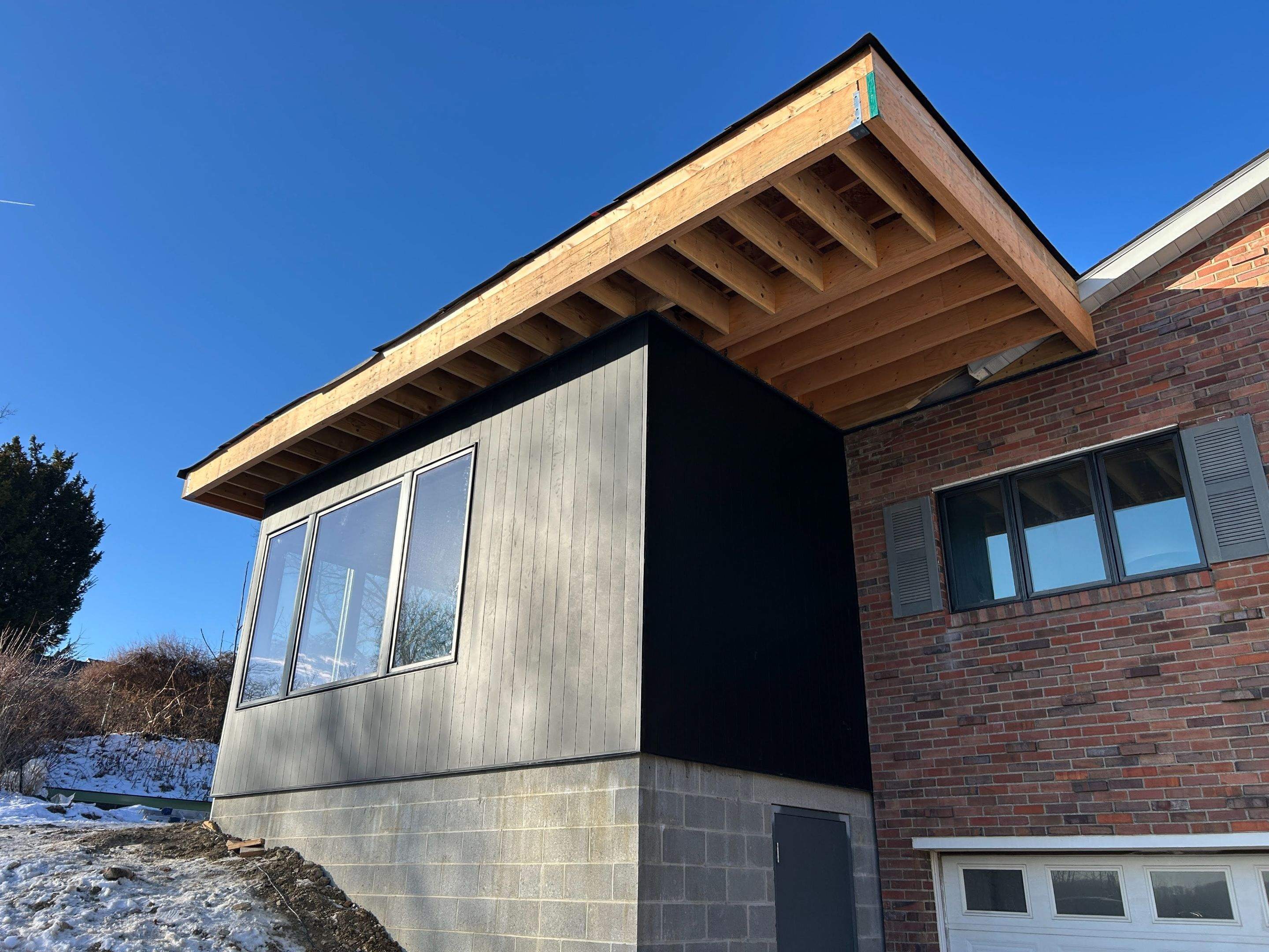 Modern Home Addition with Matte Black Siding in Pittsburgh by Ideal Siding Pittsburgh