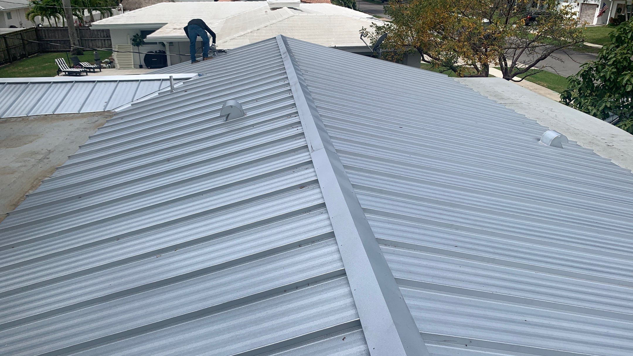 Residential Roofing Installation using 1.5'' Mechanical Seam by BLUES BROTHERS ROOFING