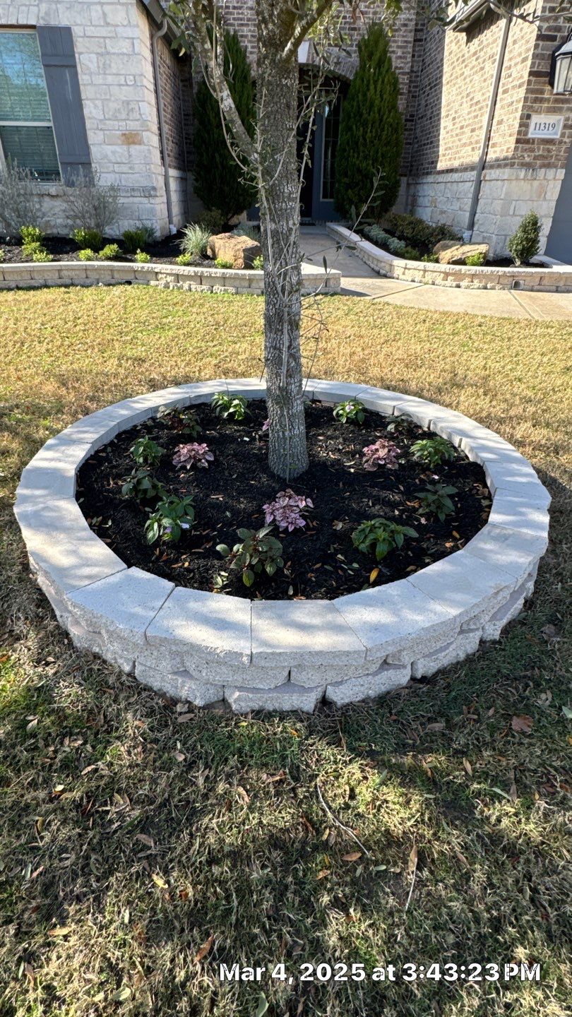 🌿✨ Darlene & Andrew’s Amazing Curb Appeal Transformation  Some projects are more than just landscaping—they’re a conversion of curb appeal from the ground up. For Darlene & Andrew, Alejandro and the Texas Urban Team designed and delivered a complete solution that reshaped their flower beds, solved drainage challenges, and gave new life to the sideyard.  💡 From planning to execution, every step was tailored to build both beauty and functionality:  🌸 Flower Beds, Reinvented  Demolition of old beds, plants, and mulch.  Fresh soil preparation, weed protection, and a brand-new retainer wall built with hand-cut stone and decorative caps.  Carefully selected plants and garden mix to ensure health and visual harmony.  💧 Drainage & Irrigation Upgrades  Outdated corrugated pipes replaced with PVC drainage lines to carry water safely away from the foundation.  New irrigation system combining drip lines and sprinklers—watering plants while keeping the house walls protected.  Sideyard drainage extended with catch basins and PVC piping to prevent water pooling and foundation stress.  🚶 Functional Sideyard with Walkway & Trash Area  Graded and leveled sideyard to manage runoff.  Installed a modern gravel and paver walkway for easy access.  Built a firm and tidy concrete-paver pad for trash containers—making the space both practical and polished.  🛠️ Stonework & Craftsmanship  Every stone in the retainer wall was cut, set, and secured by the team of handcrafters, ensuring a durable build that doubles as a design statement.  ✅ Outcome: Darlene & Andrew’s property now has better drainage, a clean and organized sideyard, and elegant new flower beds—all designed for long-term durability and lasting beauty.  📢 Before hiring anyone, review our portfolio. Our work speaks louder than words—each project is a blend of function, protection, and design crafted to last. by Texas Urban Elements