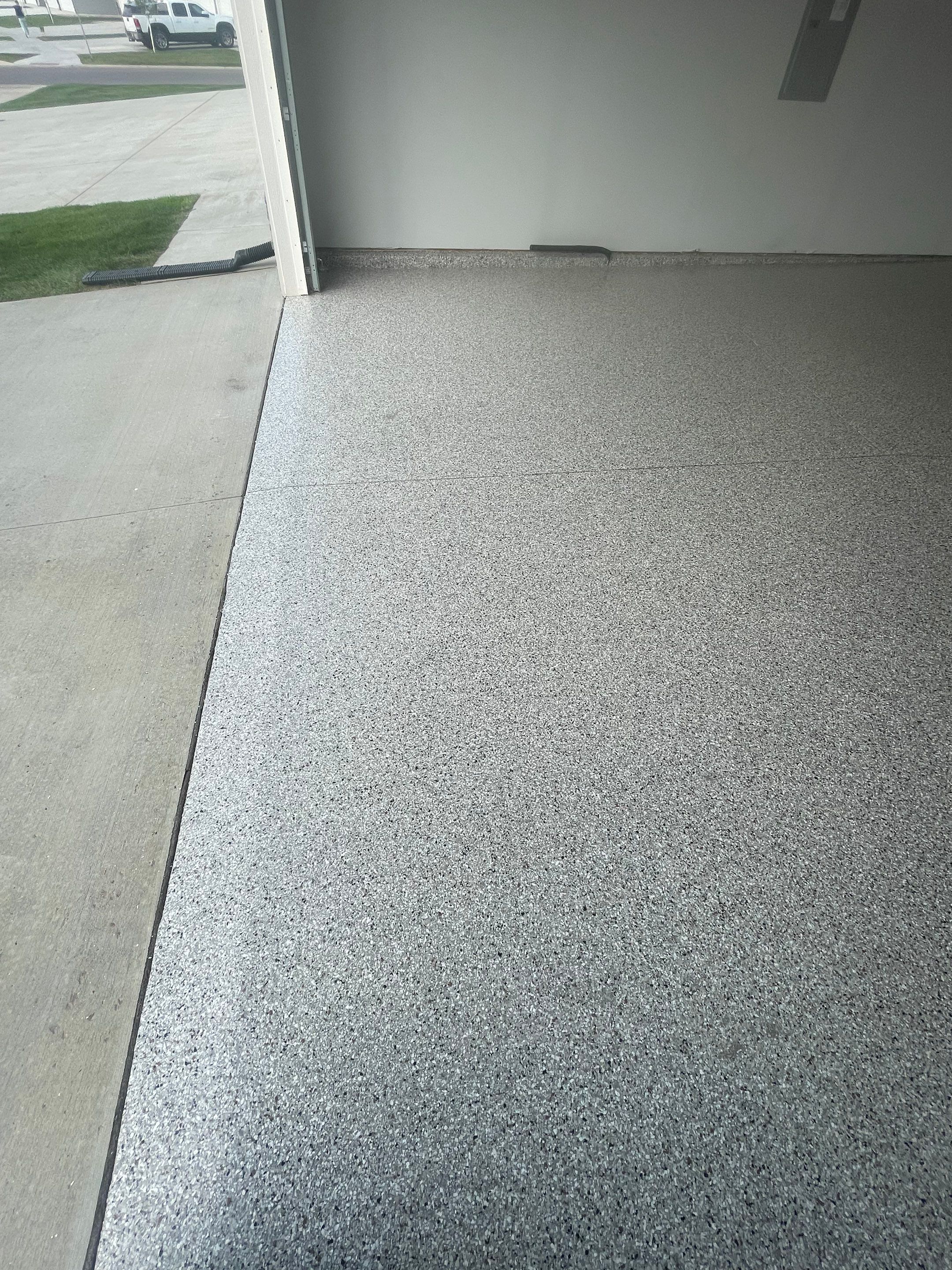 Custom Coyote Flake Garage Floor Coating in Sioux Falls by Select Painting, Coatings & Garage Cabinets