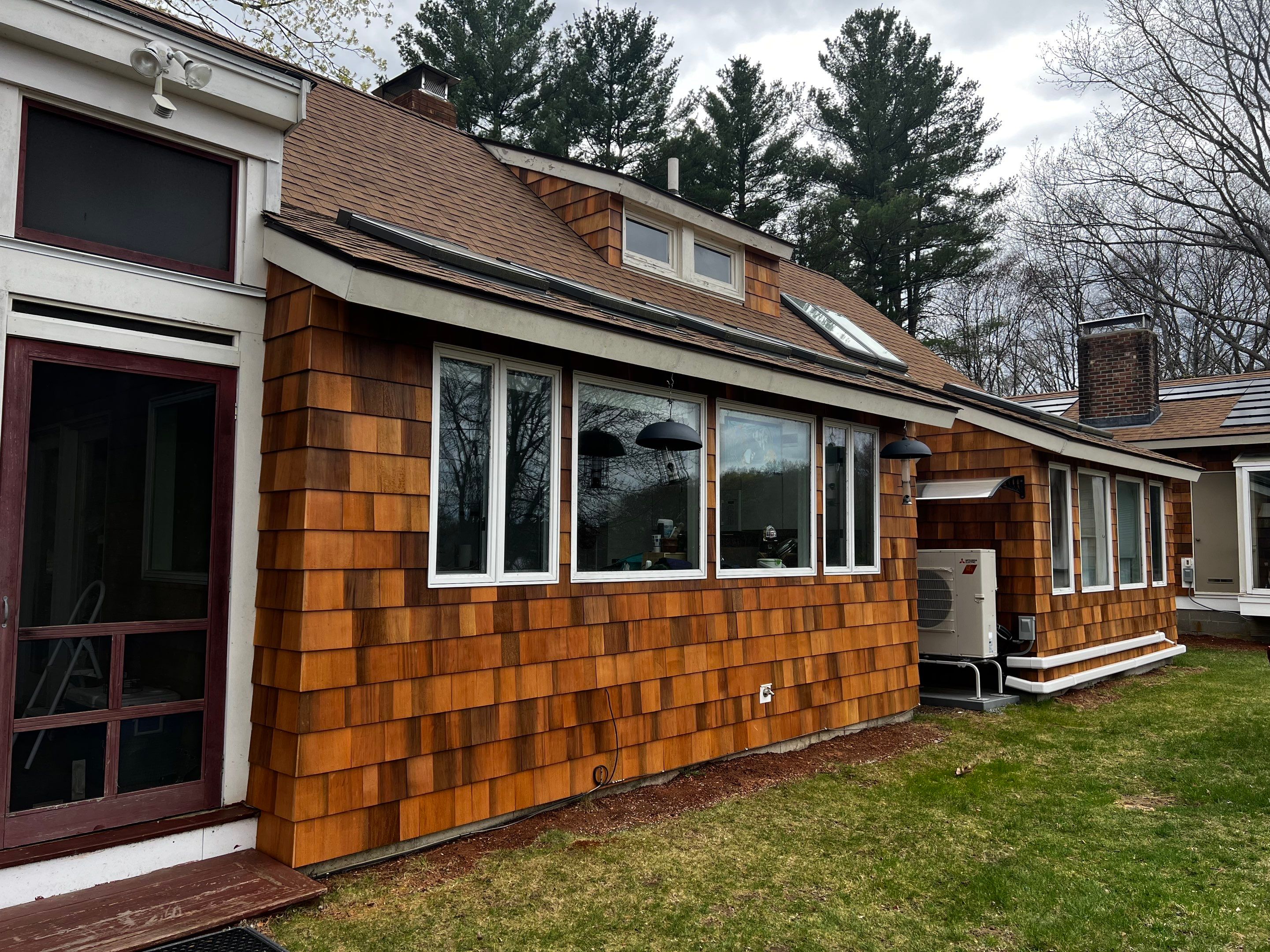Siding Installation using Perfection Red Western Cedar Shingles  by Loyalty Exterior Solutions 