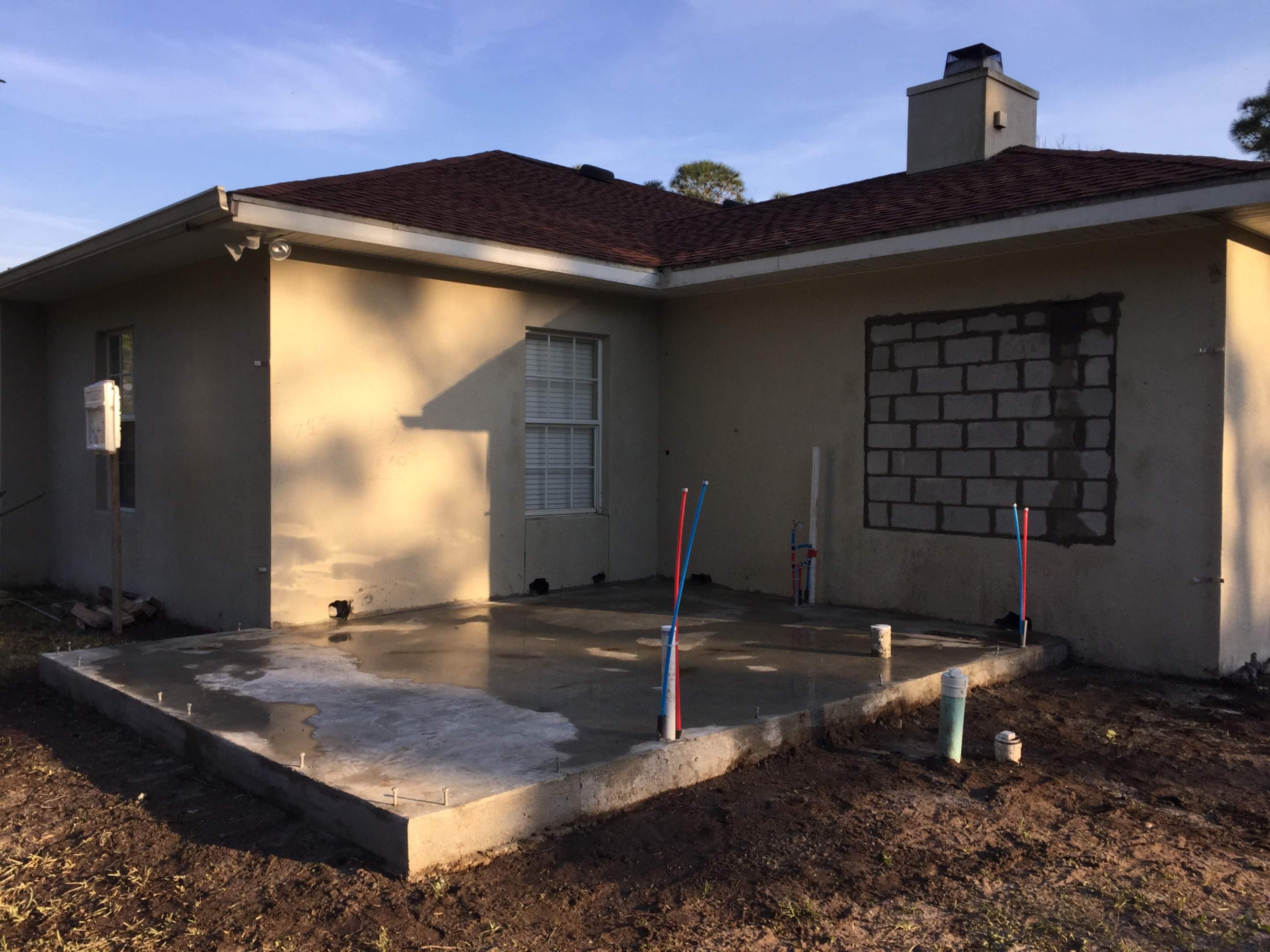 Residential Bedroom Addition with Concrete Slab and Stucco in Palm Bay by Florida Roofing and Renovations Inc.