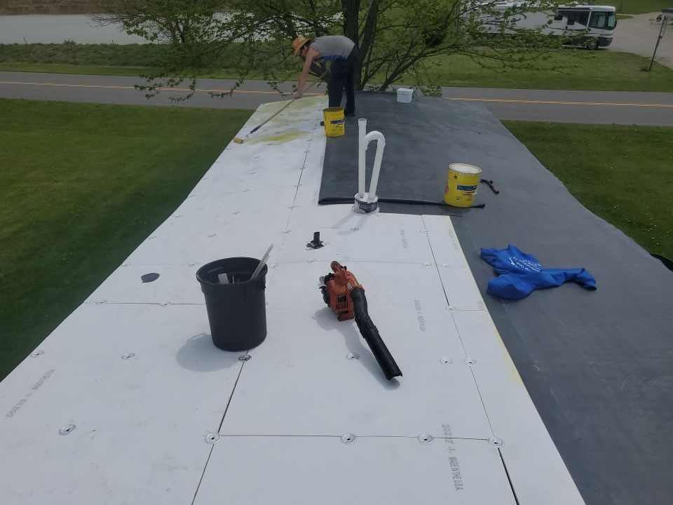 Residential Roofing Installation using 60 mil rubber roof  by Nitro Roofing and Construction