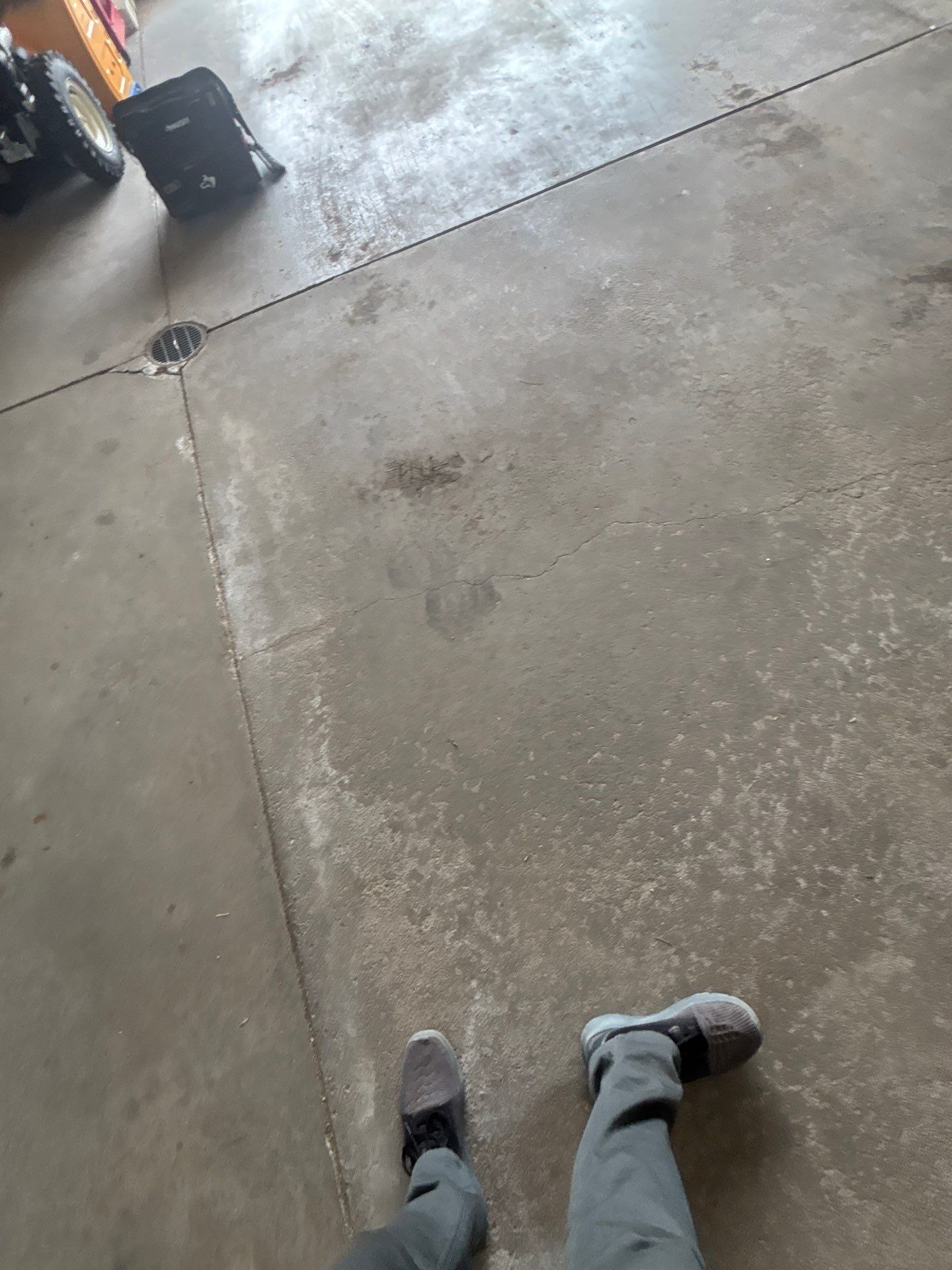 Sioux Falls Garage Floor Repair and Speckled Epoxy Coating Installation by Select Painting, Coatings & Garage Cabinets