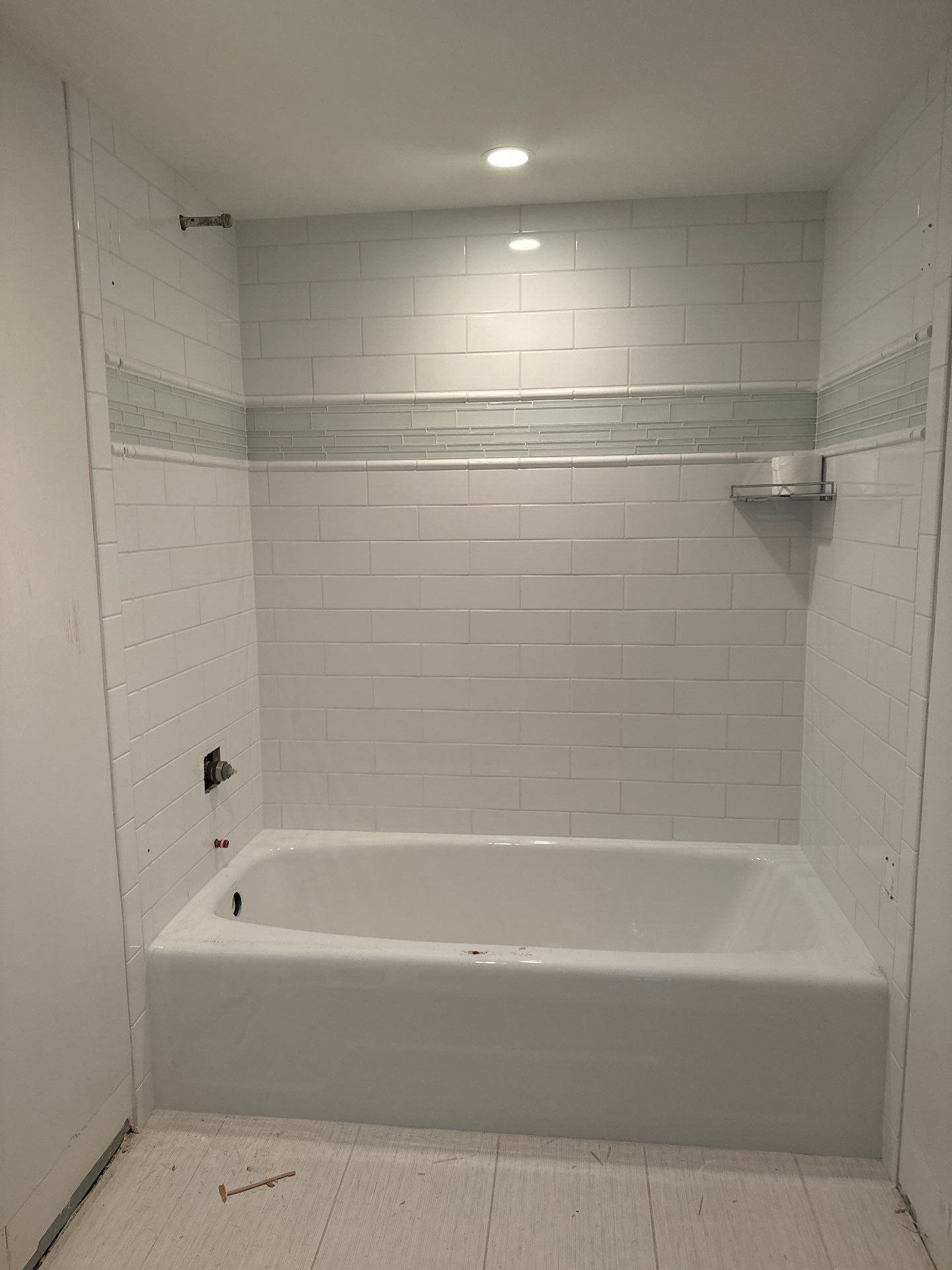 High-Rise Bathroom Remodel by Naples Flooring Boutique