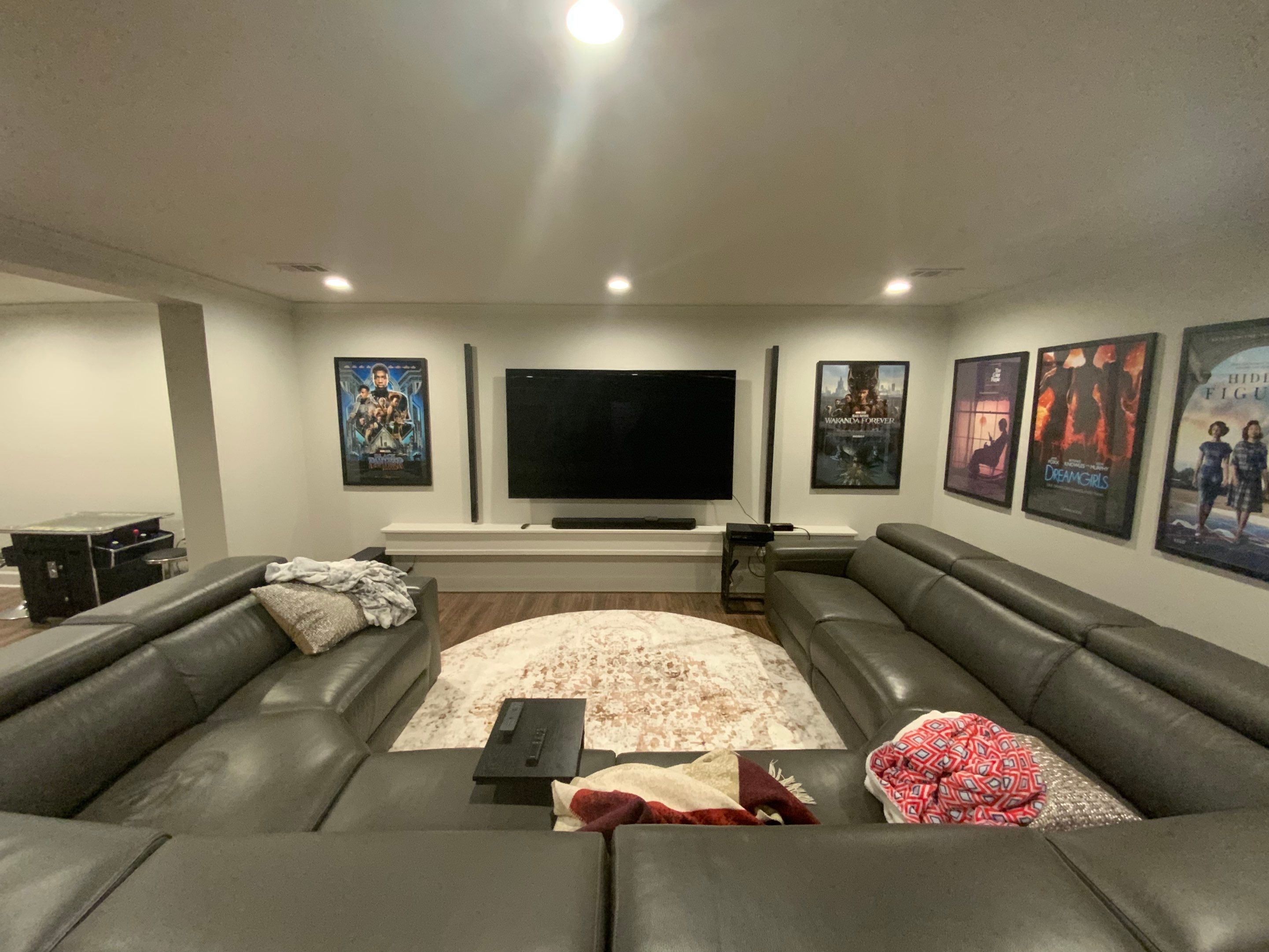 Finished Basement Renovation Featuring Home Theater and Custom Wine Cellar by Swift Home Renovations