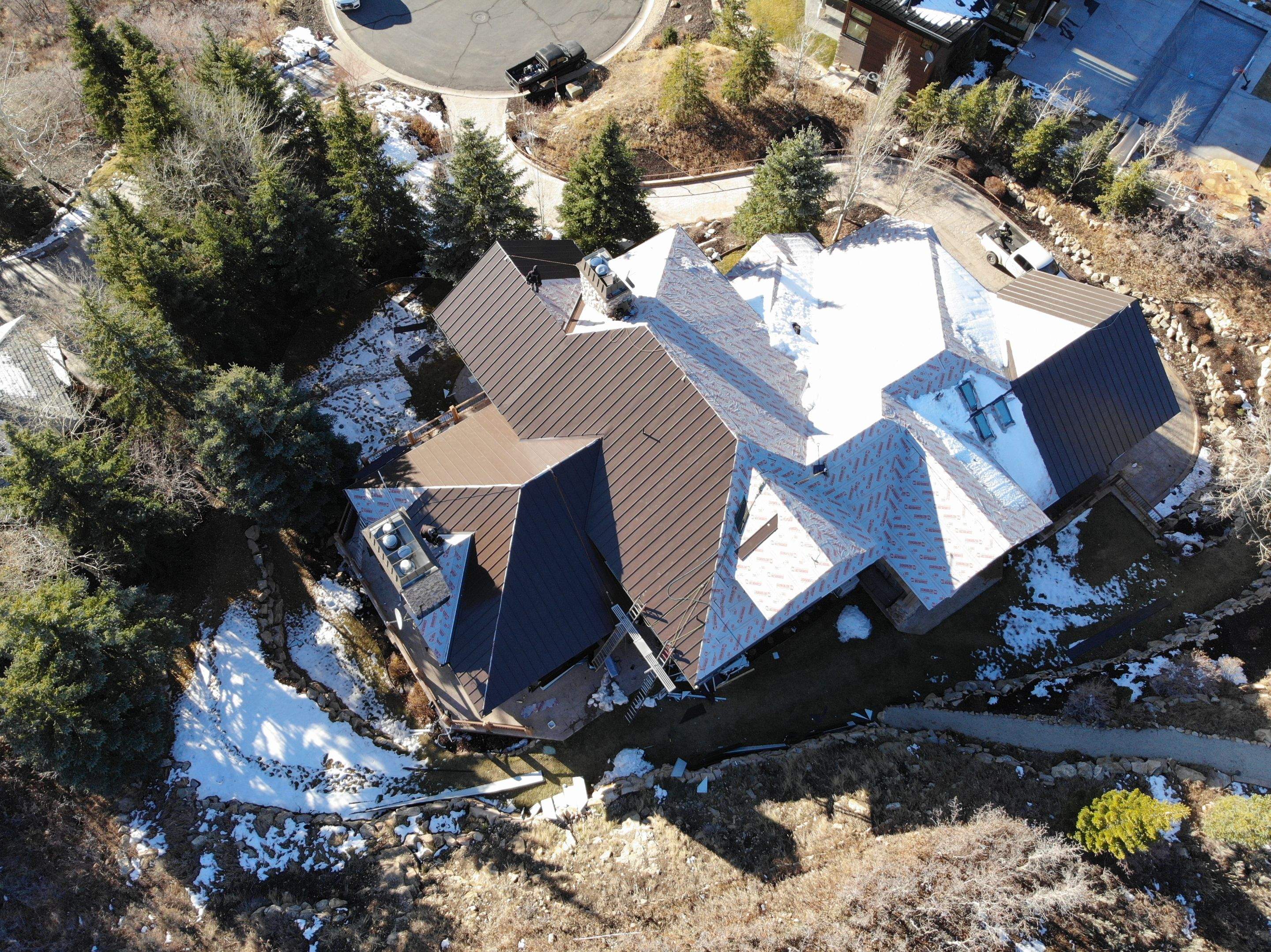 Standing Seam Metal Roof Replacement After Snow Damage by ASAP Roofing & Restoration