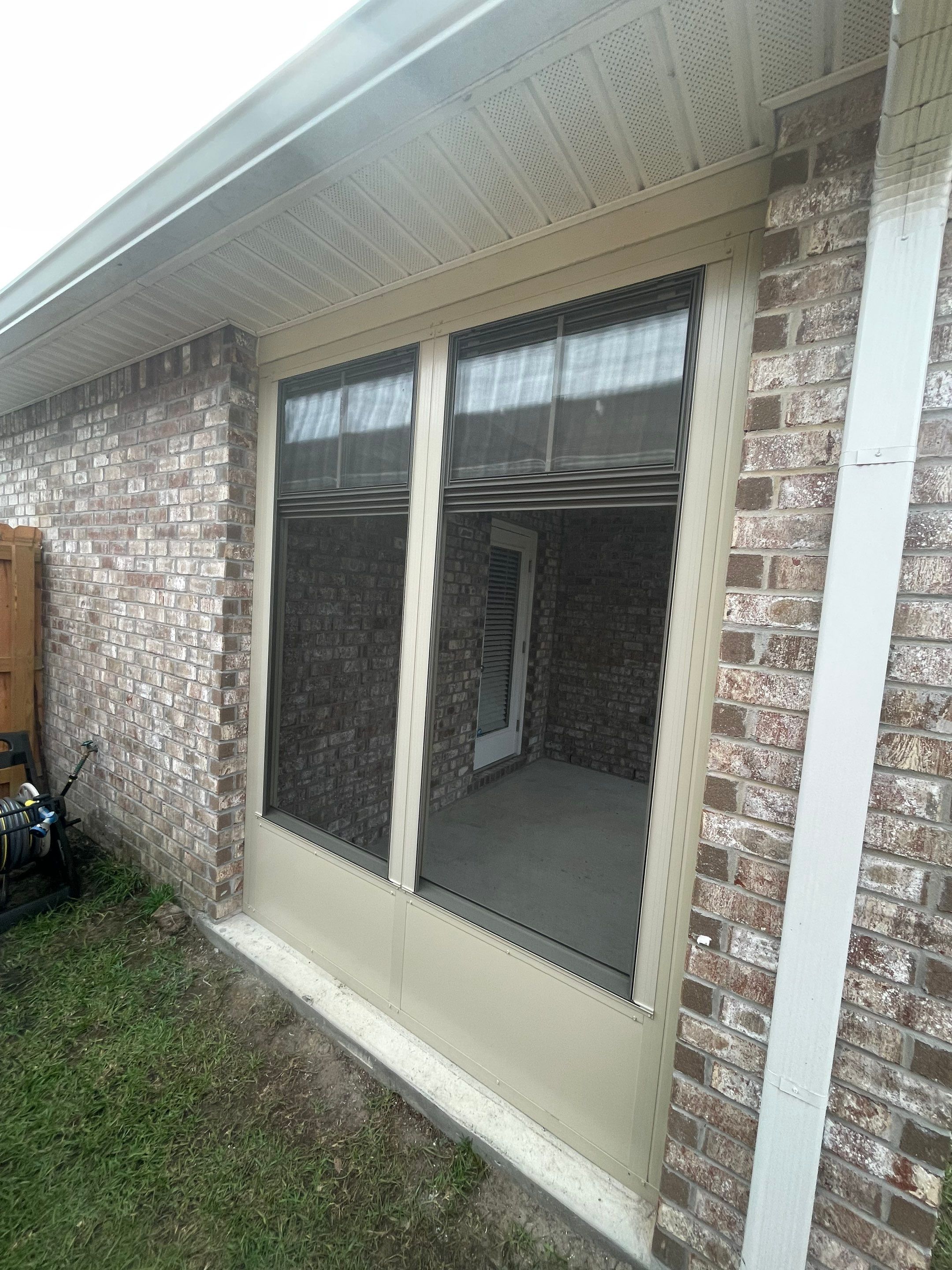 Panama City Glass Room Under Existing Patio Cover by Titan Sunrooms