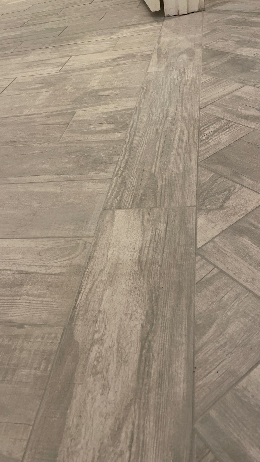 Herringbone and plank tile by Footprints Floors of East Atlanta