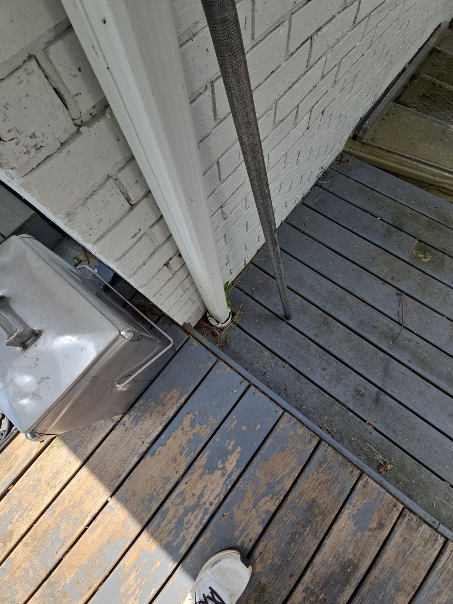 Black Gutter and Gutter Helmet Installation for Suttons Bay Home by Rainbow Seamless Systems