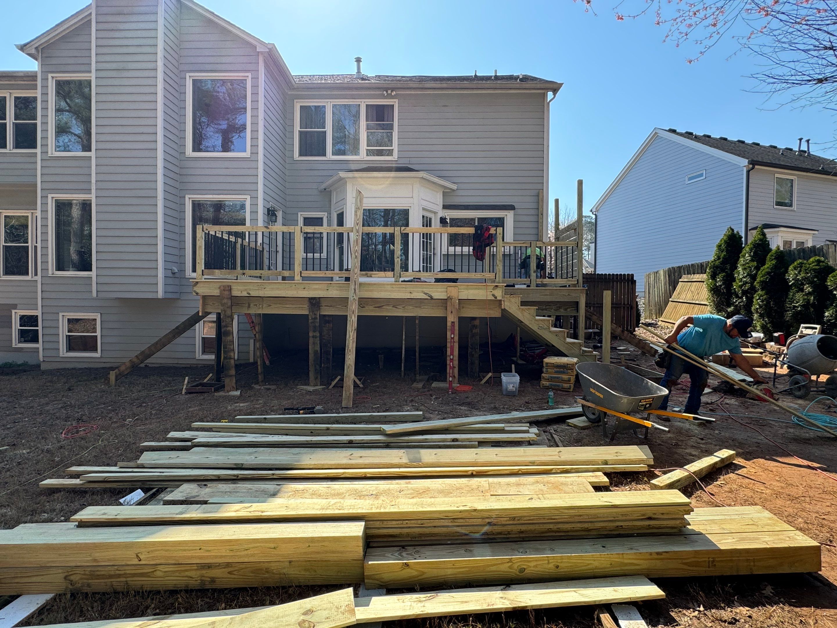 Elevated Deck Replacement with Black Metal Railings in Johns Creek by Swift Home Renovations