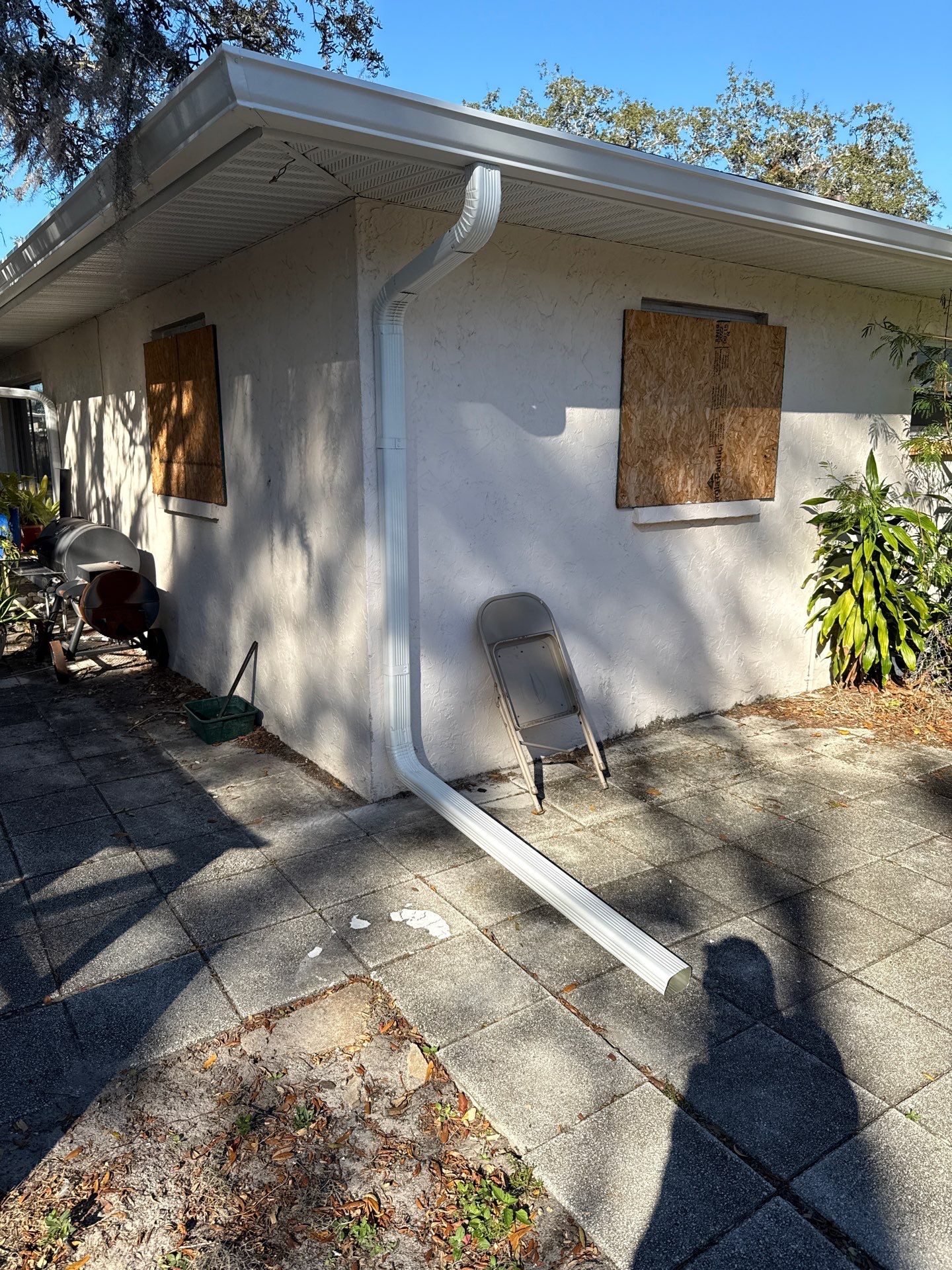 Downspout Installation using White Down Spouts in Sarasota FL by Gutter Professors