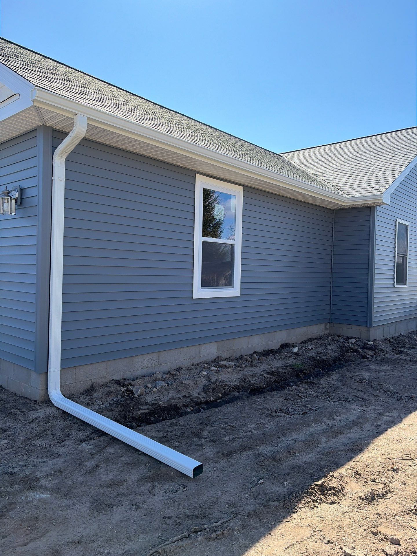Gutter System Installation for New Home Construction in Petoskey by Rainbow Seamless Systems