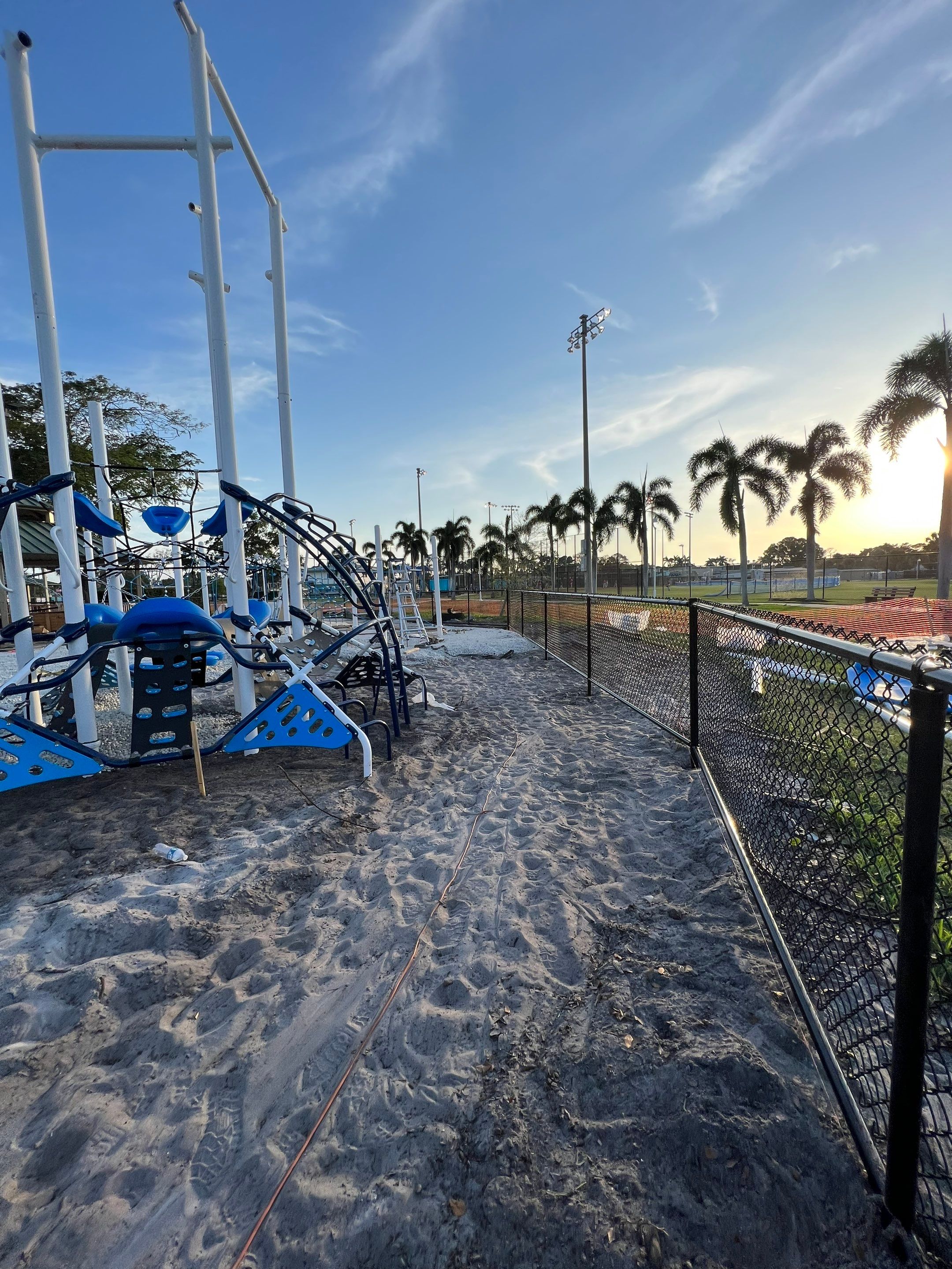 Vinyl Coated Chain-link fence for the City of Naples around Fleischmann Park Playground.  by Asap fence and gates, LLC