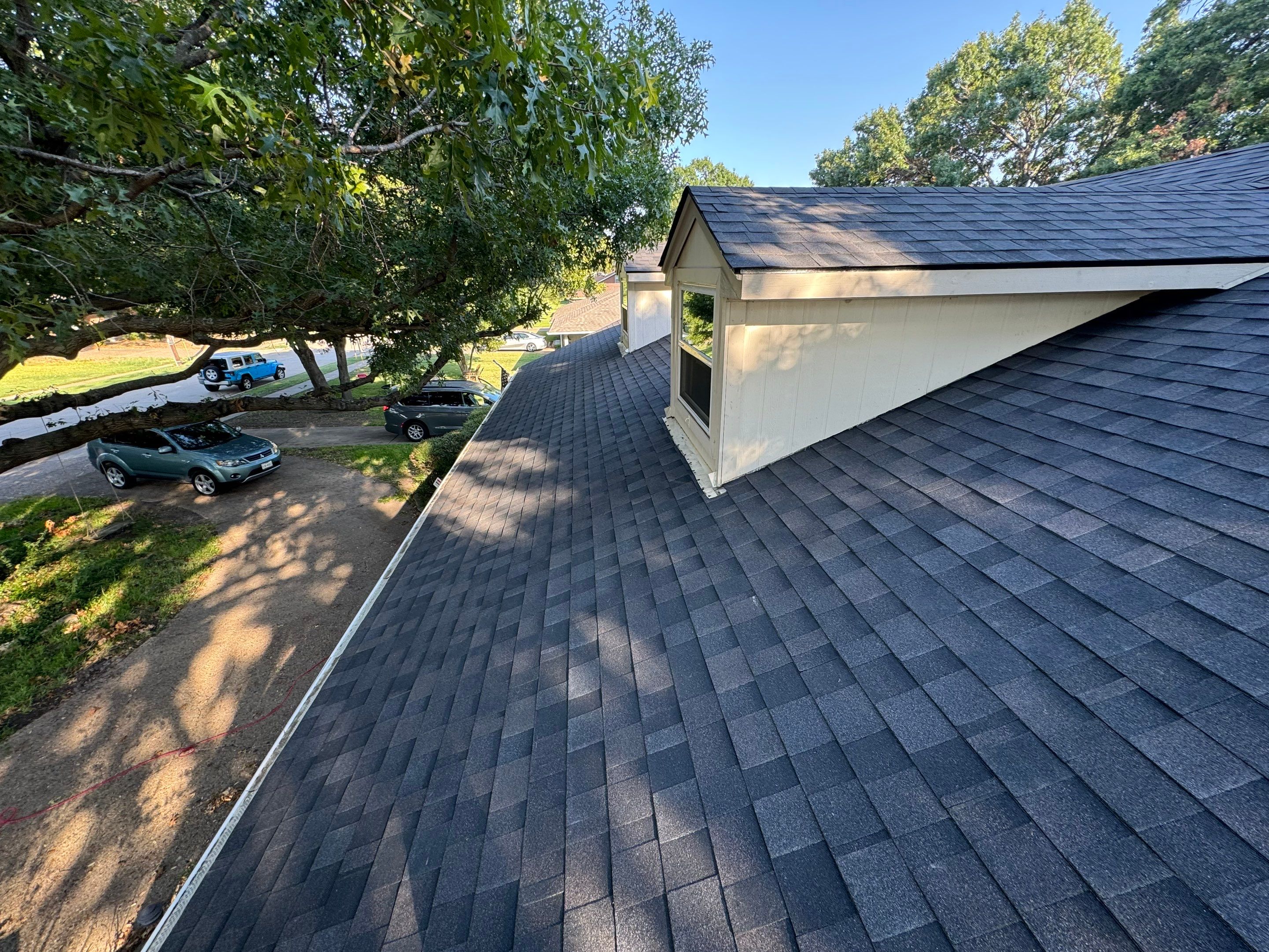 IKO Glacier-White brick house by Tejas Roofworks + Restoration