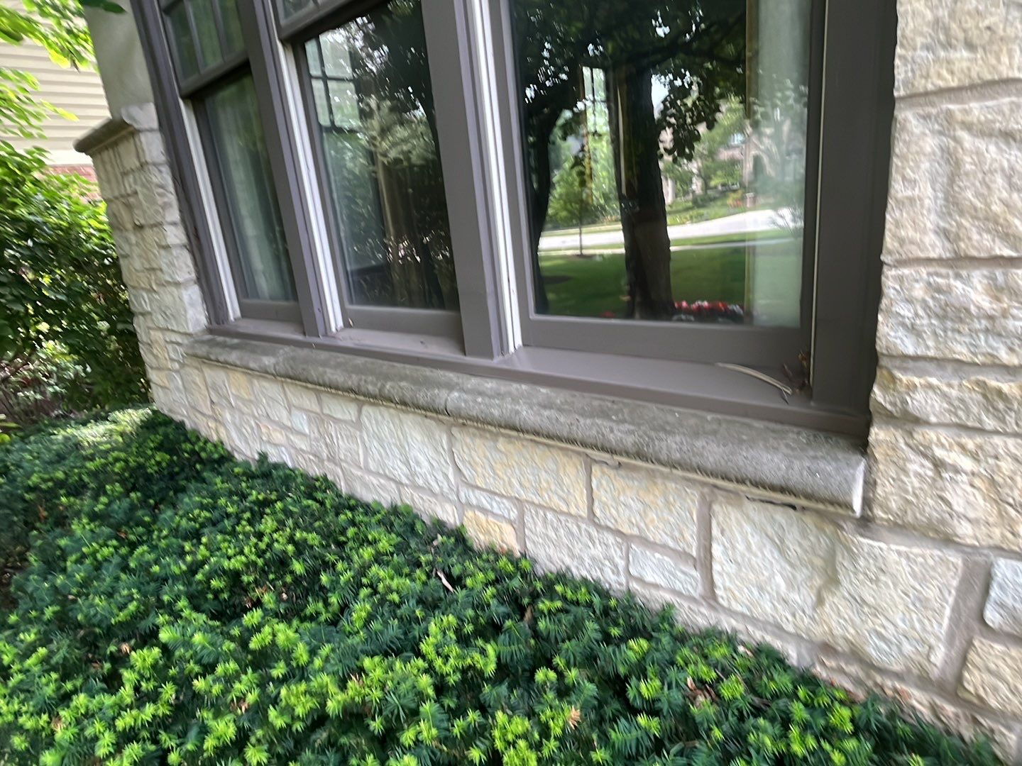 Northbrook, IL stucco home soft wash and stone cleaning by Northern Power Washing LLC.