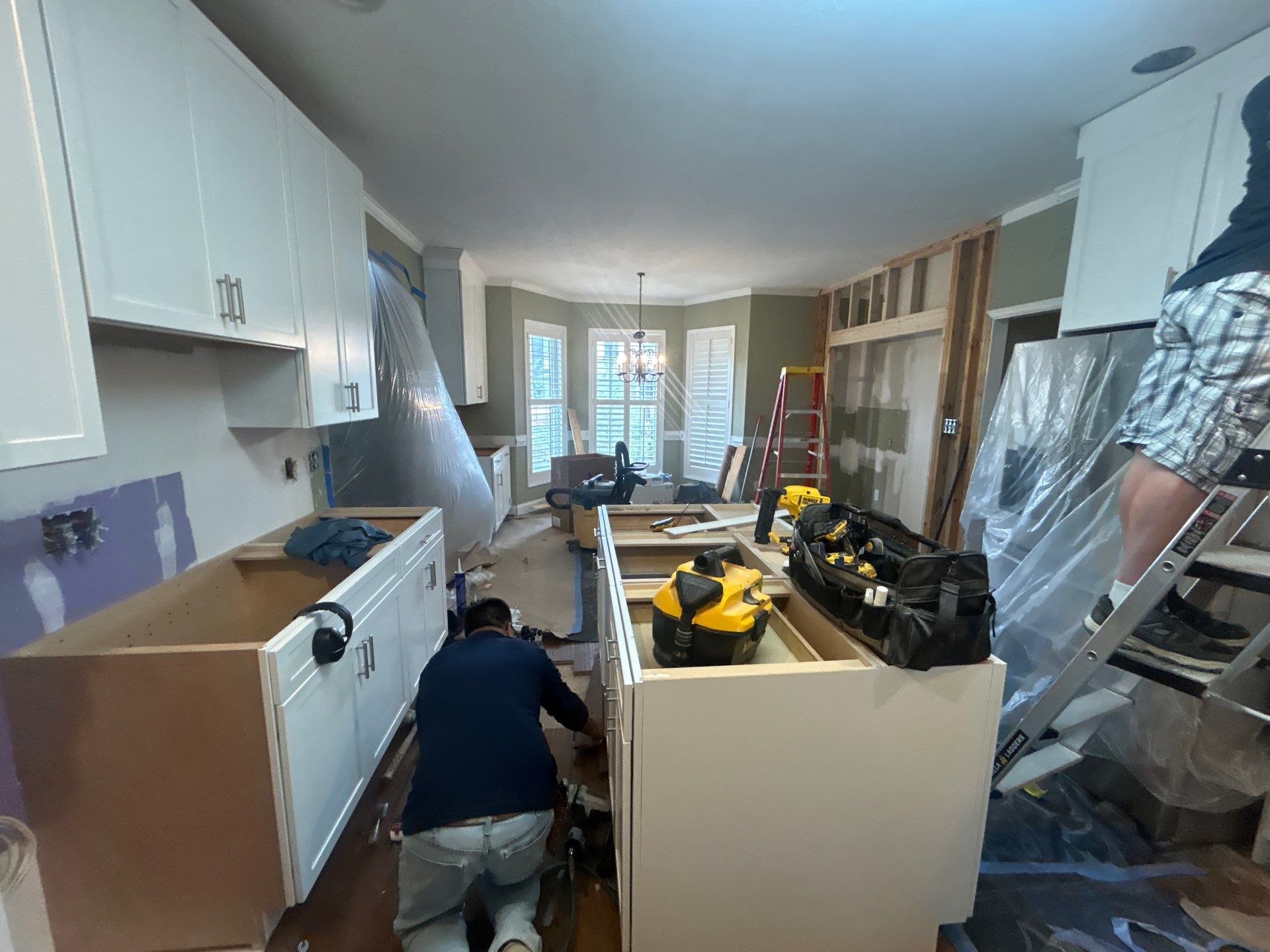 Complete Kitchen Renovation Featuring White Shaker Cabinetry in Fayetteville by Karcher Roofing & Construction
