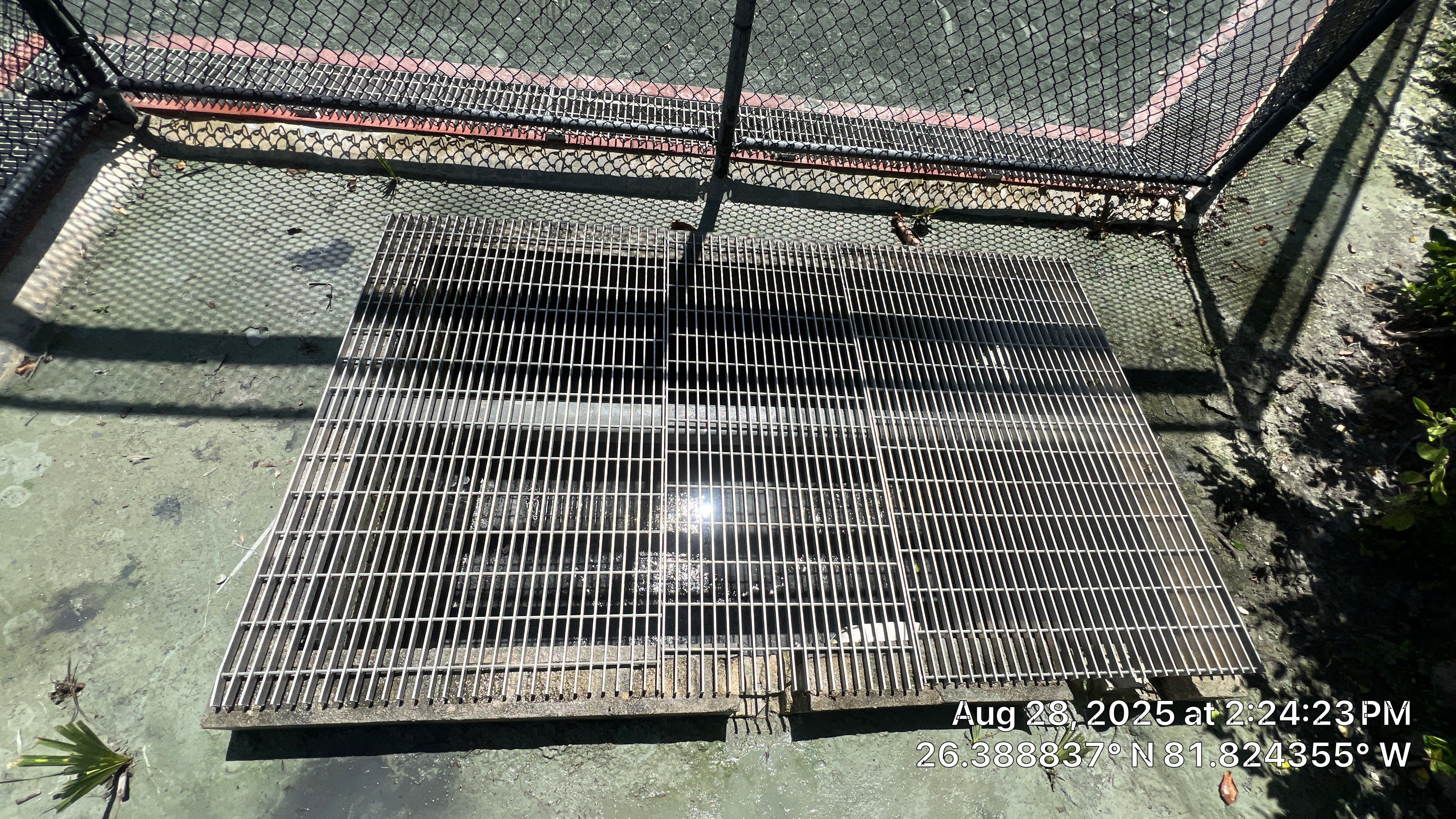 Pelican Landing Tennis Court Catch Basin Cleaning by APS Power & Water