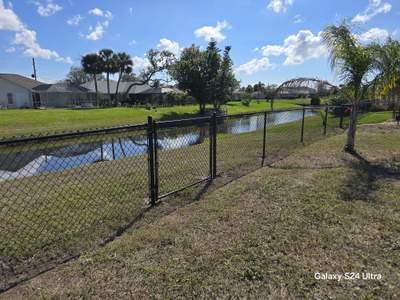 Waterfront Black Chain Link Fence Installation in Rotonda West