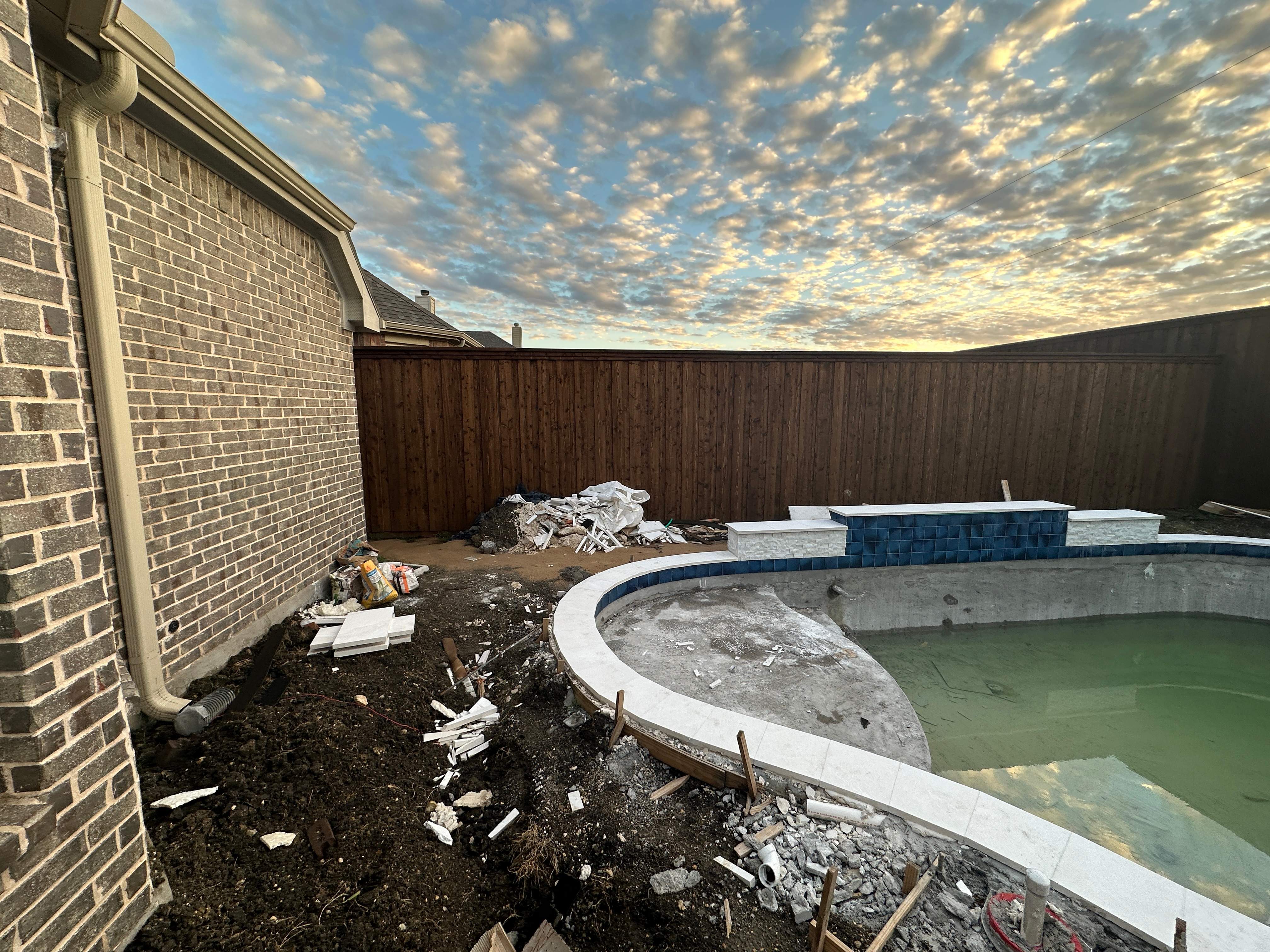 Freeform Pool with Rock Waterfall and Raised Spa by Pinnacle Pools and Spas - DFW