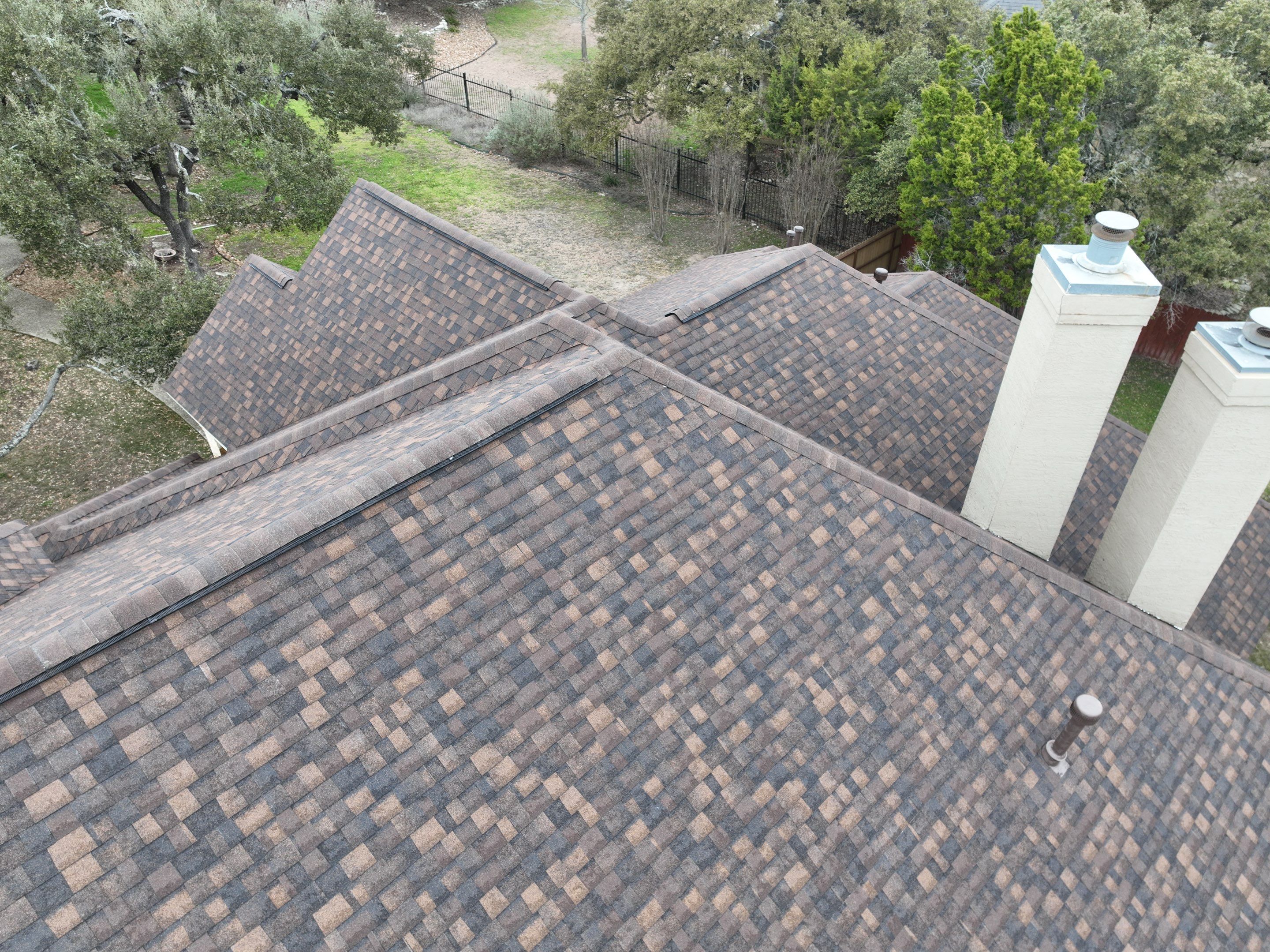 Residential Roof Replacement using 30 Year Laminate Shingles with High Profile Ridge by Premier Roofing and Contracting