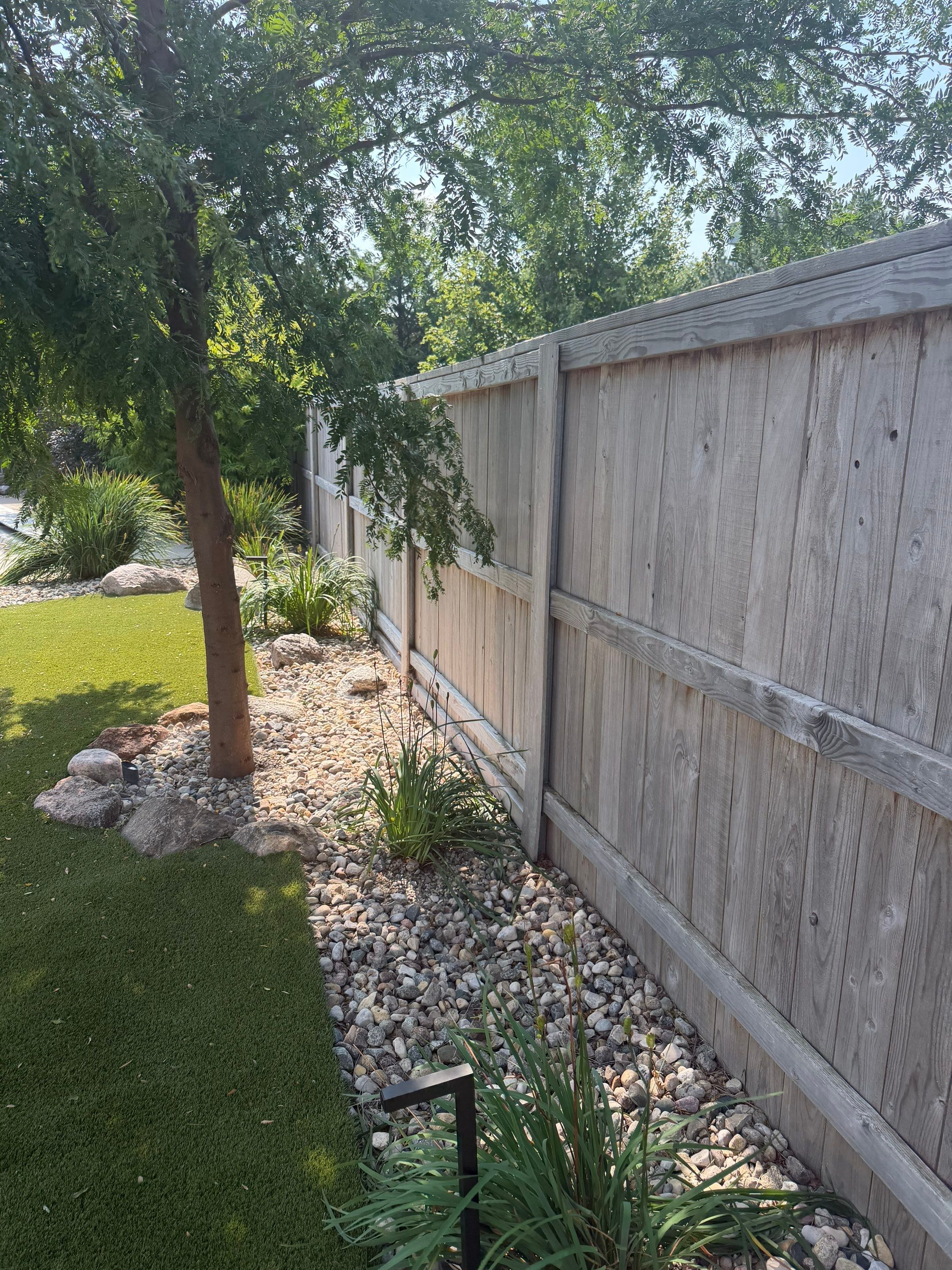 Custom Privacy Fence and Paver Patio Installation in Sioux Falls by Select Painting, Coatings & Garage Cabinets