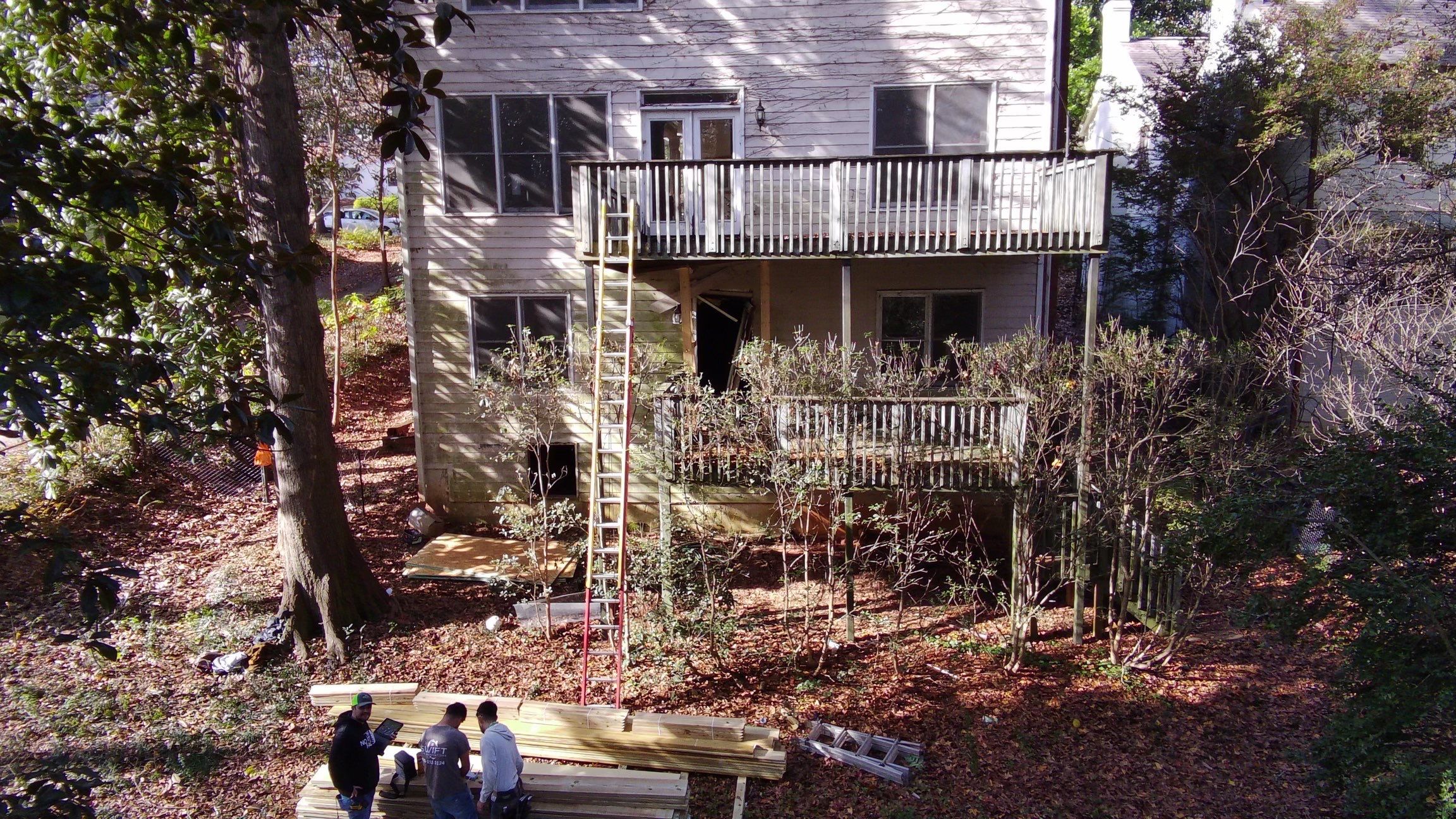 Multi-Level Pressure-Treated Wooden Deck Construction in Decatur by Swift Home Renovations