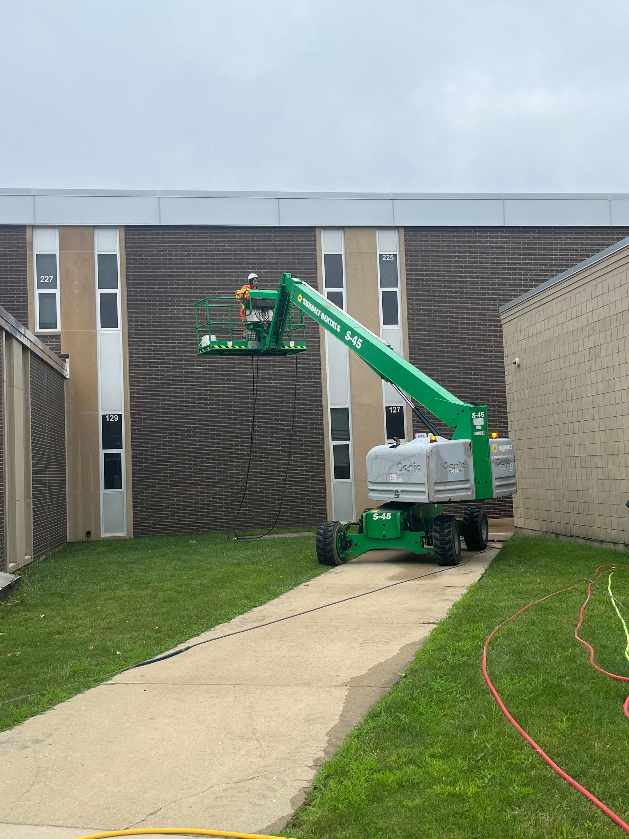 commercial pressure washing using Algaecide, soft wash soap by Northern Power Washing LLC.