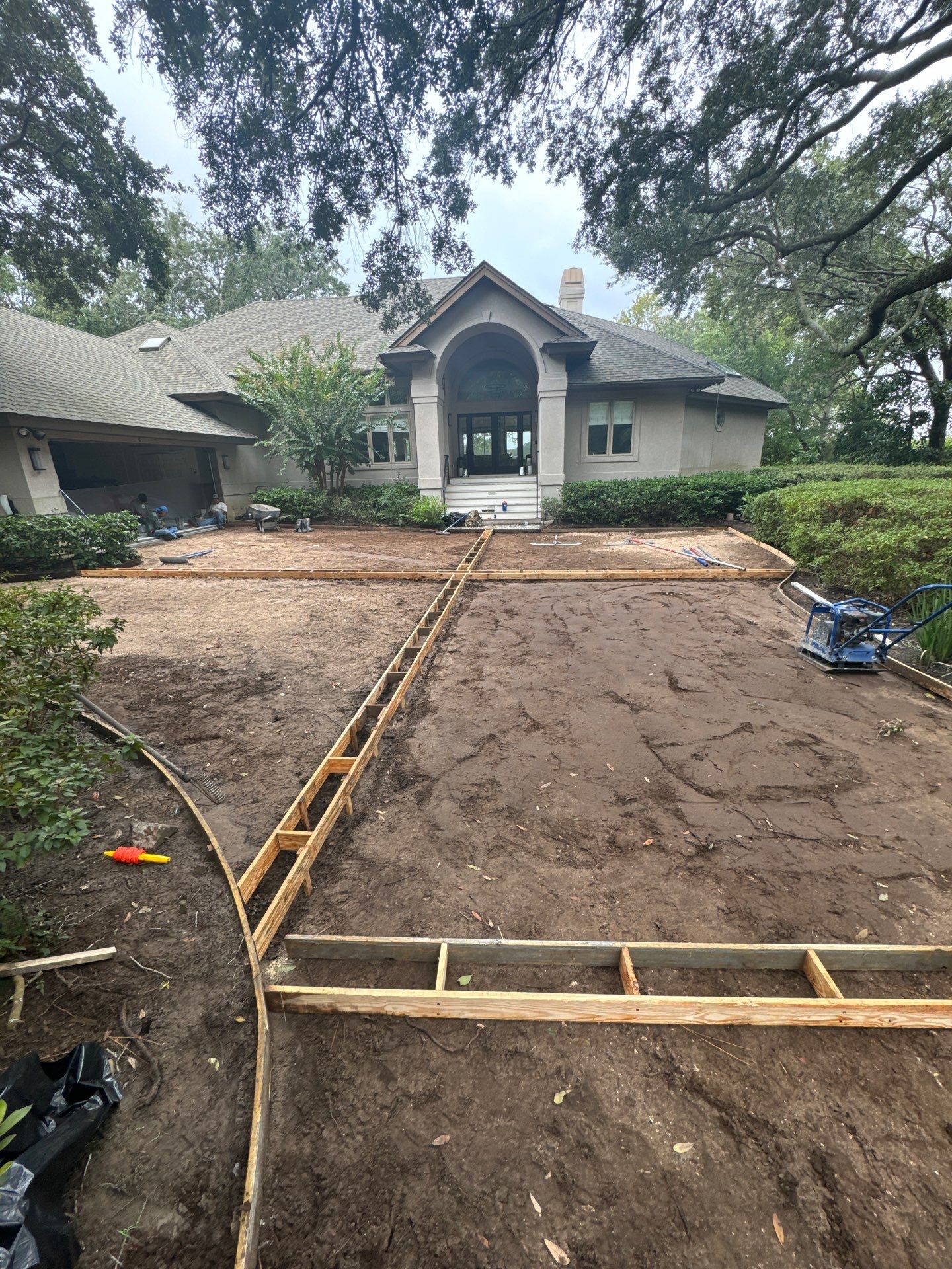 Custom Concrete Driveway with Decorative Paver Inlays in Hilton Head Island by Lowcountry Scapes, LLC