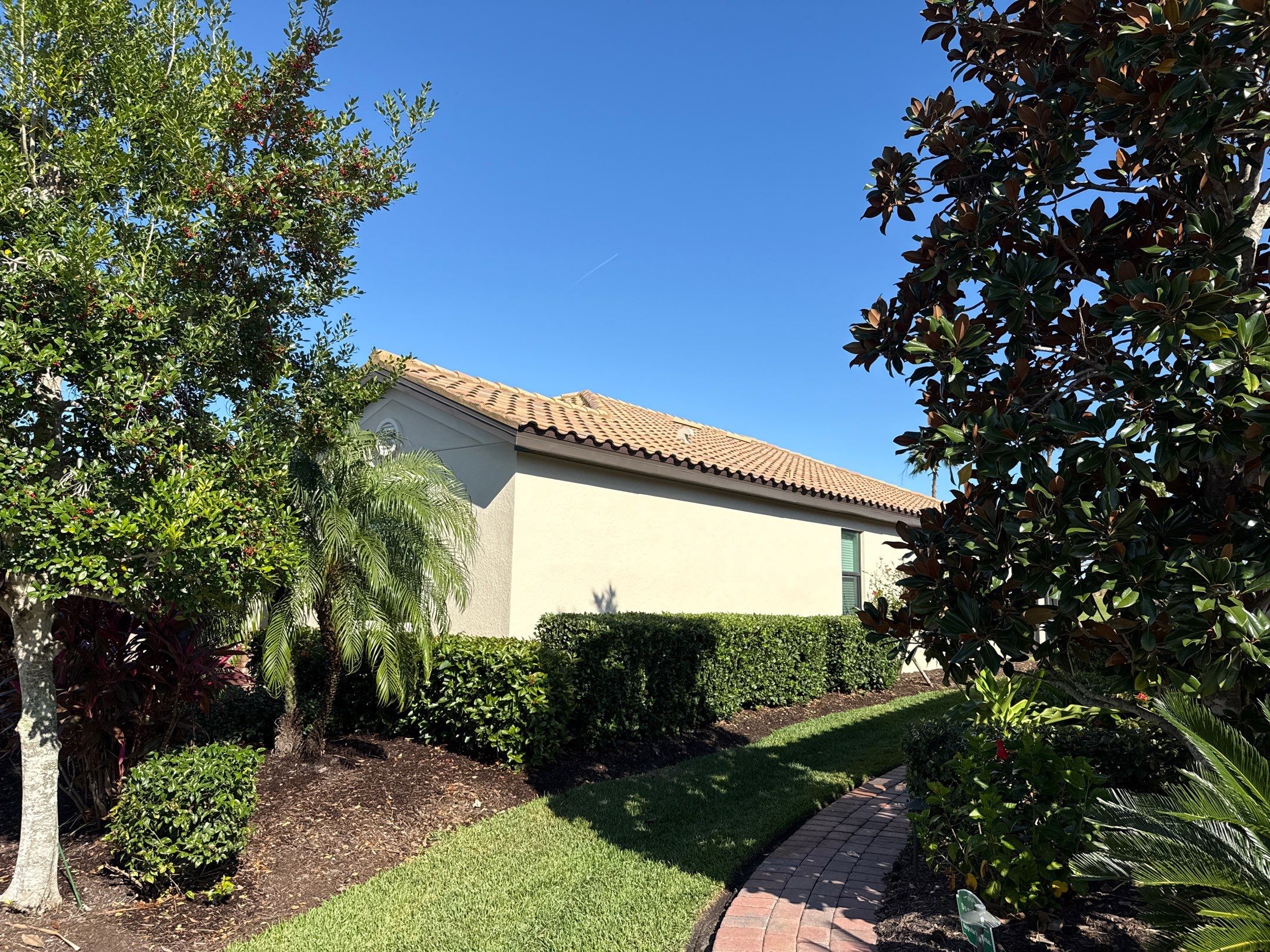 Barrel Tile Roof Cleaning & Paver Driveway Cleaning in River Strand at Heritage Harbour | Bradenton, FL by Sunshine AquaWash