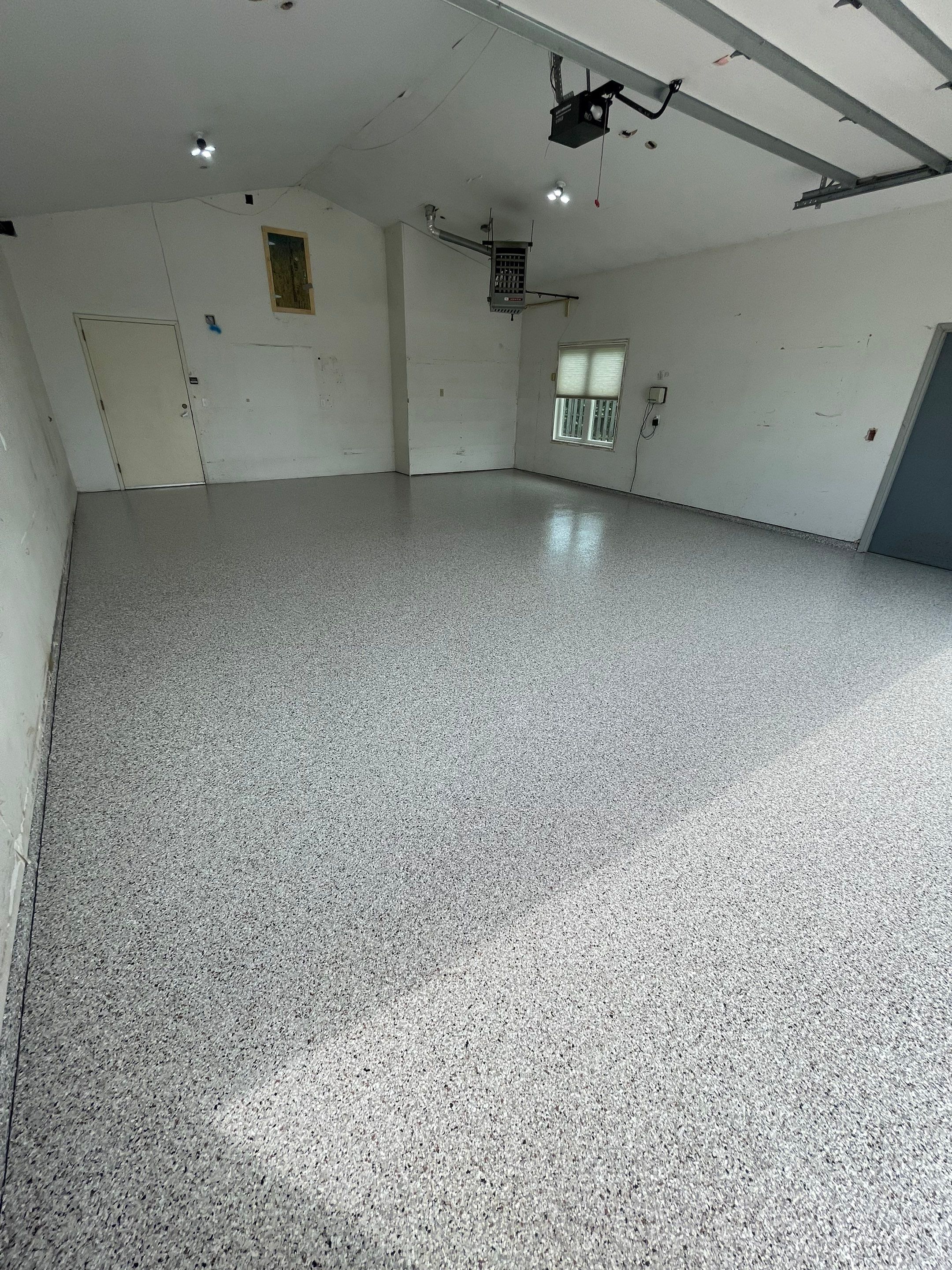 Coyote Flake Concrete Coating for Sioux Falls Garage by Select Painting, Coatings & Garage Cabinets