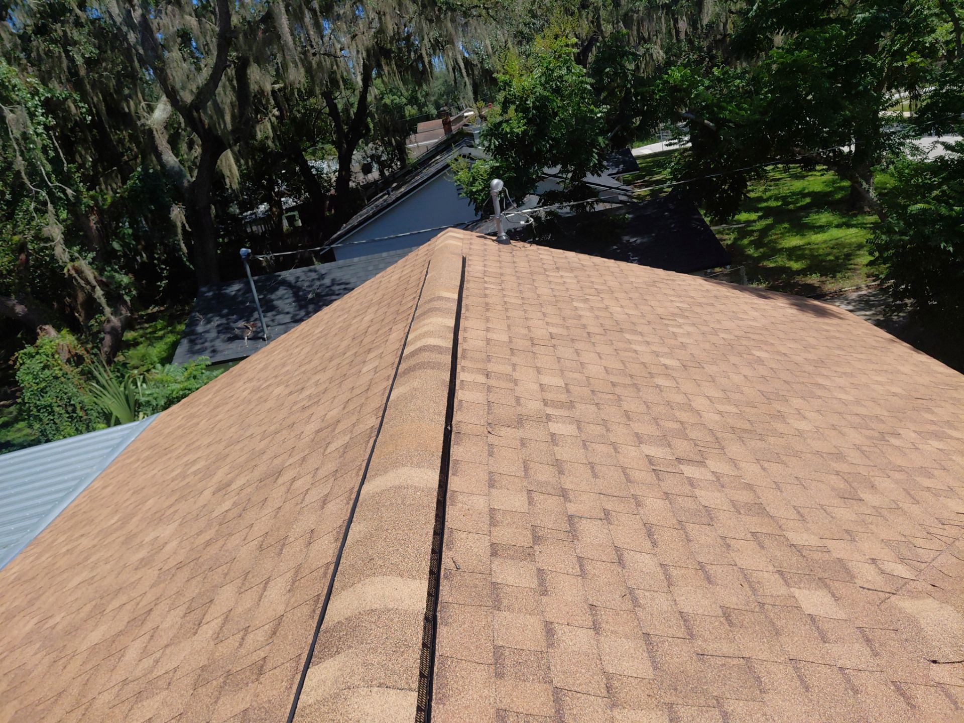 Combined Shingle and Metal Residential Roof Replacement in Leesburg Florida by Pinnacle Roofing Group