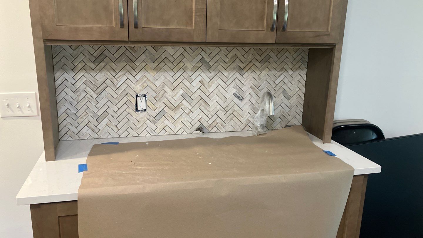 Beautiful Herringbone Backsplash  by Footprints Floors of Nashville