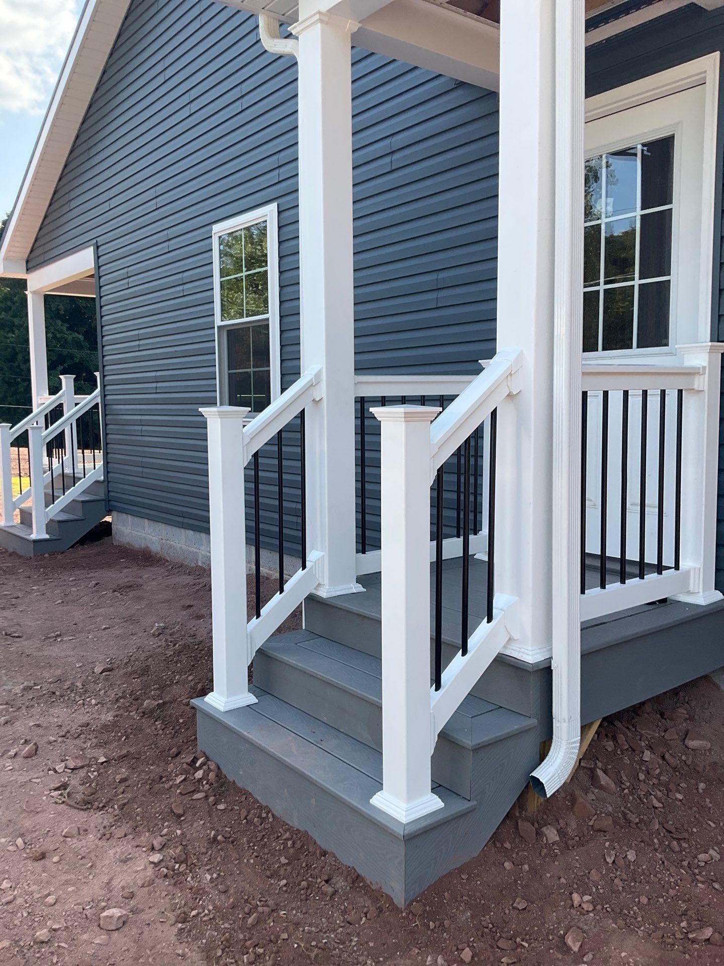 New Residential Addition with Blue Siding and Metal Roofing in Ashland by Esh Builders
