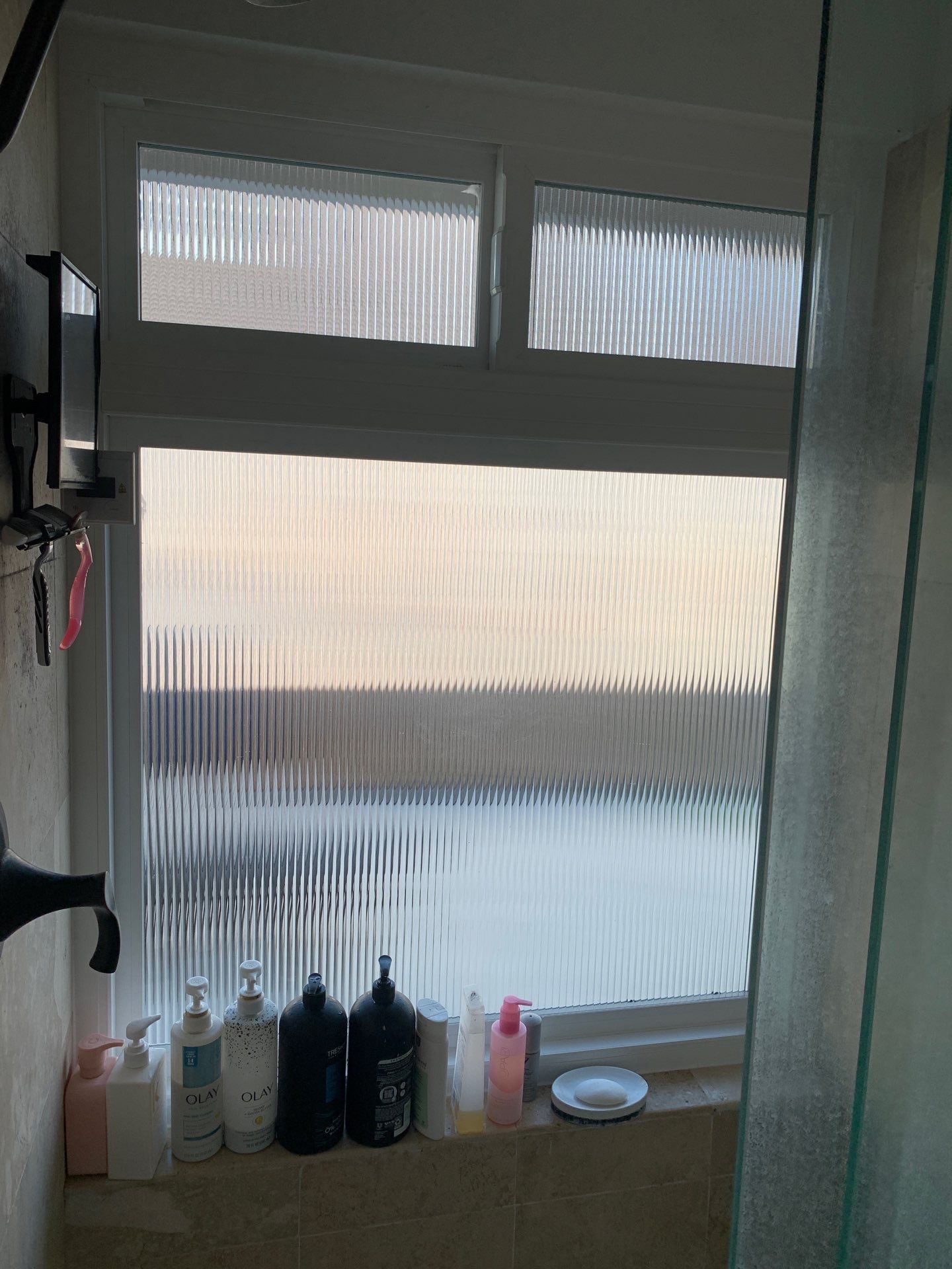 Window Installation using Milgard black vinyl windows by American Window Company