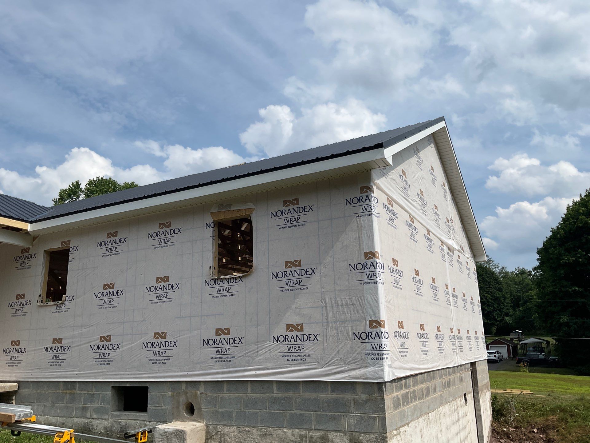 New Residential Addition with Blue Siding and Metal Roofing in Ashland by Esh Builders