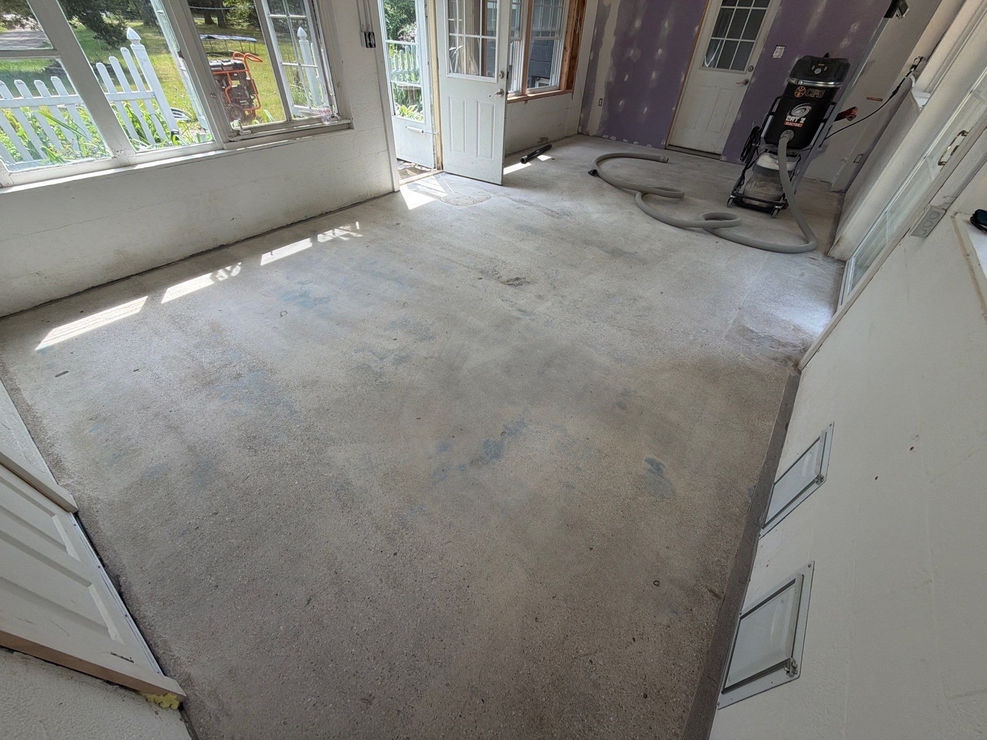 Grey Epoxy Flake Floor Installation for a Muskegon Sunroom by Gordon Painting