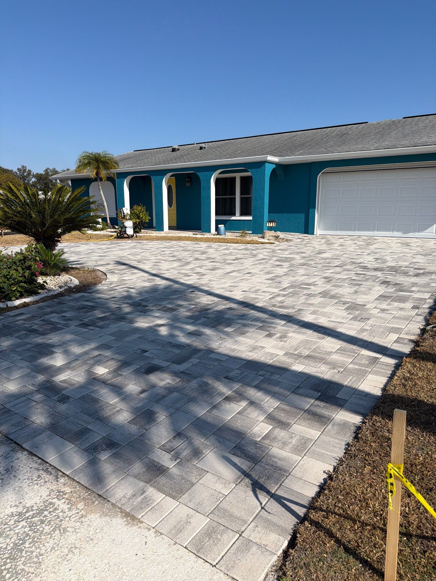 Modern Gray Paver Driveway and Entryway Walkway in Sun City Center by Supreme Paver Experts