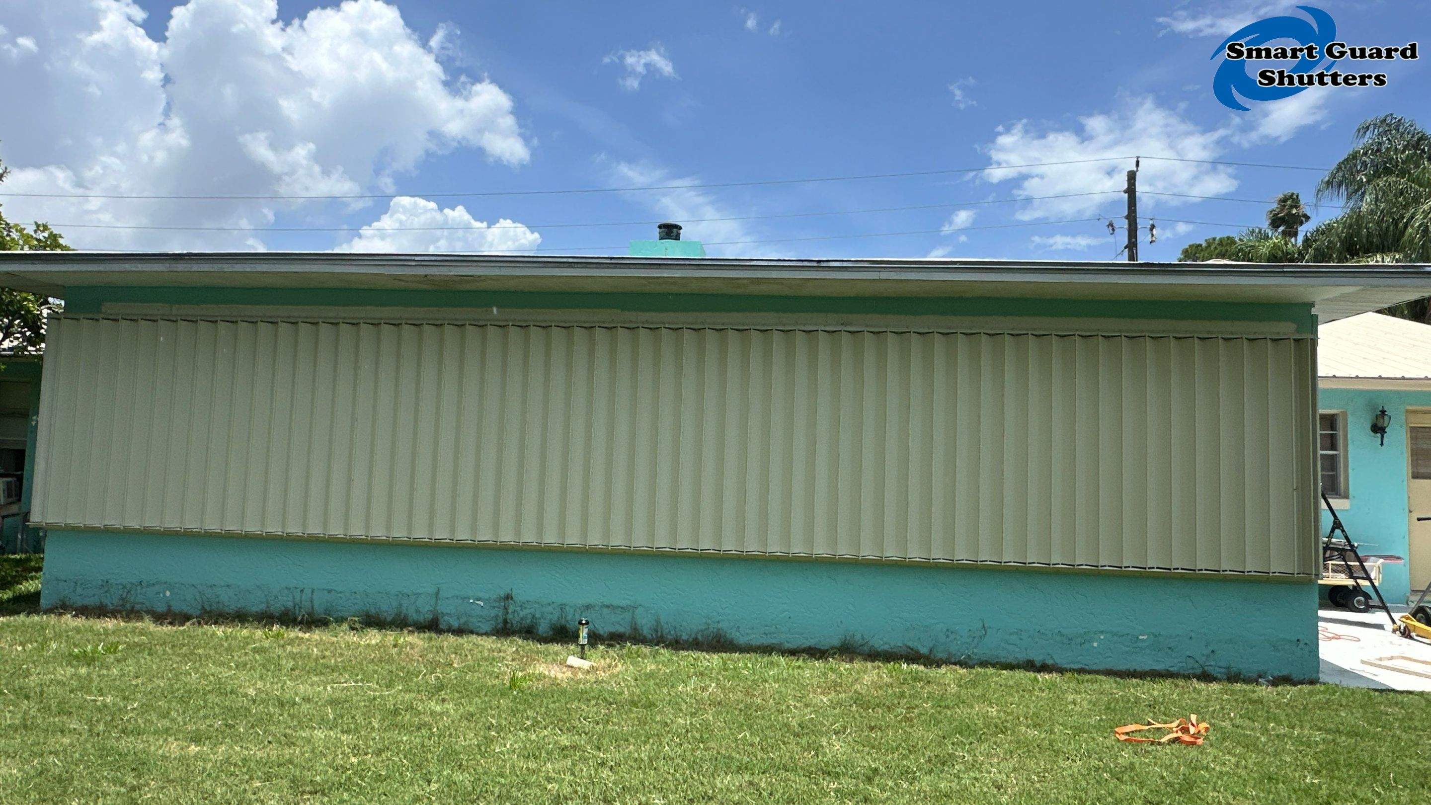 Accordion Shutter in Ivory by Smart Guard Shutters