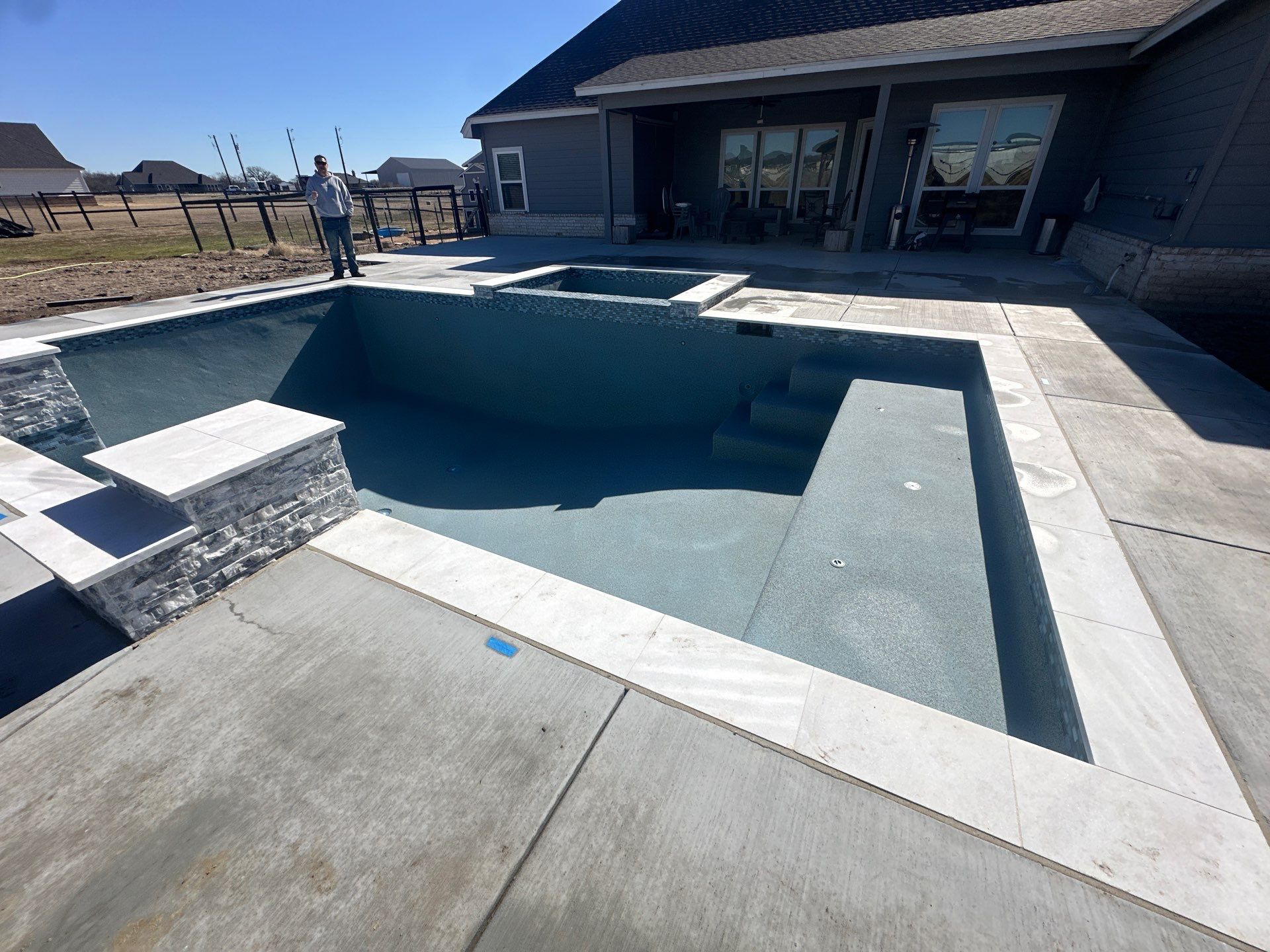 Geometric Pool with Tanning Ledge and Cedar Pergola by Pinnacle Pools and Spas - DFW