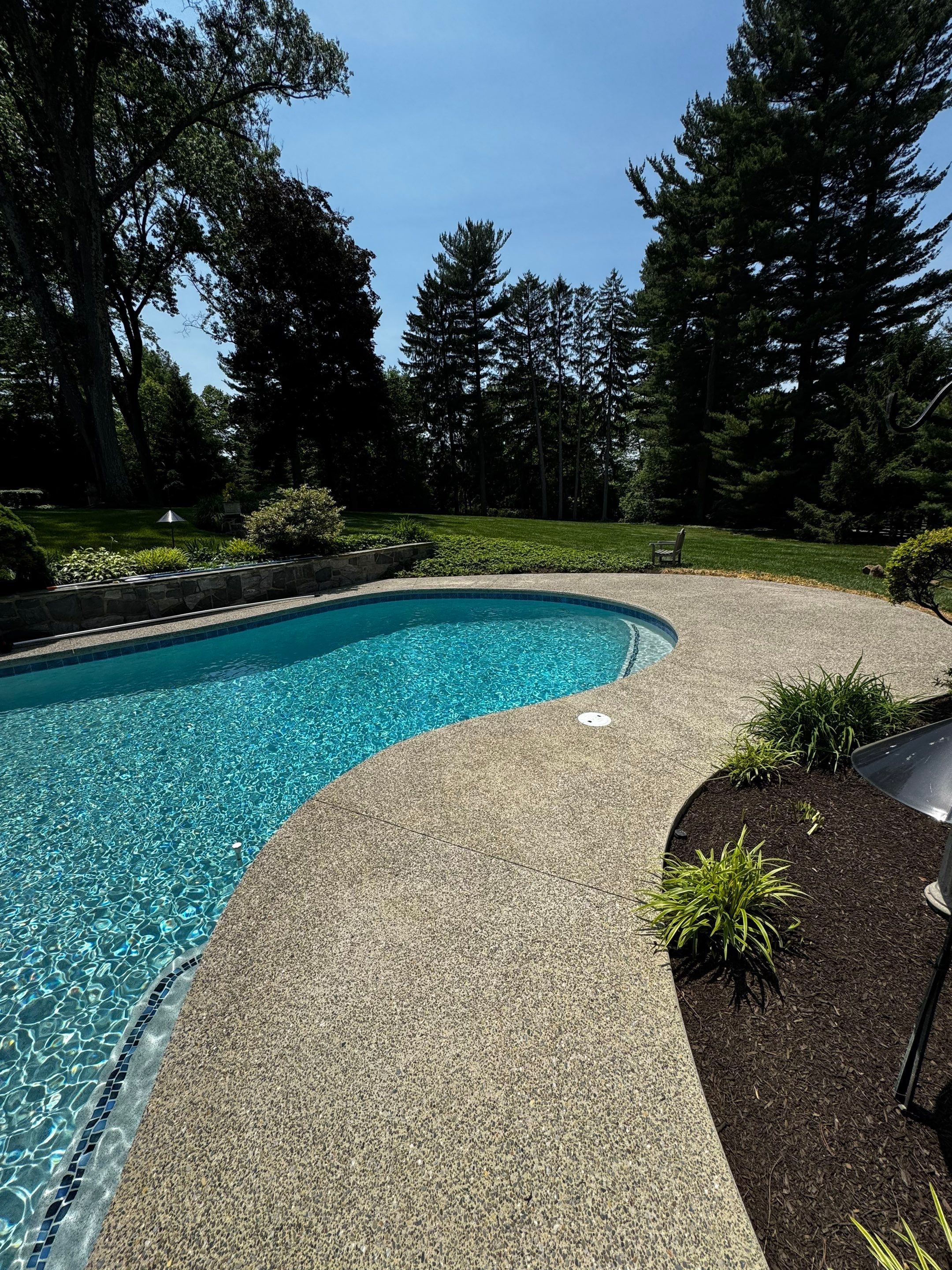 Exposed Aggregate Pool Deck Renovation in Villanova by Architectural Concrete Design