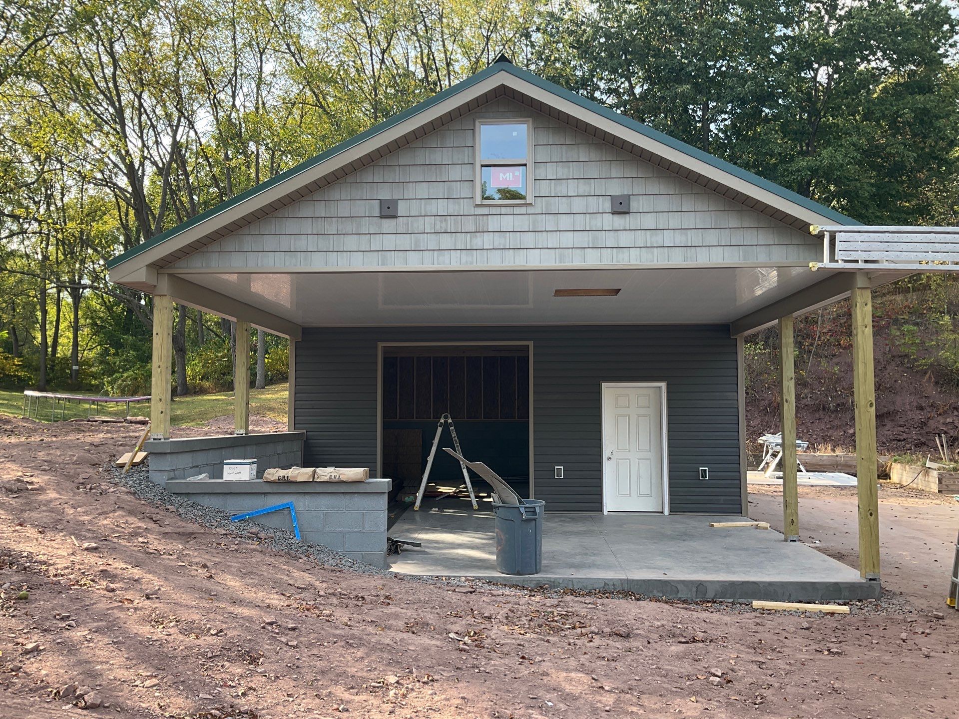 Detached Garage Construction with Vinyl Siding and Metal Roof by Esh Builders