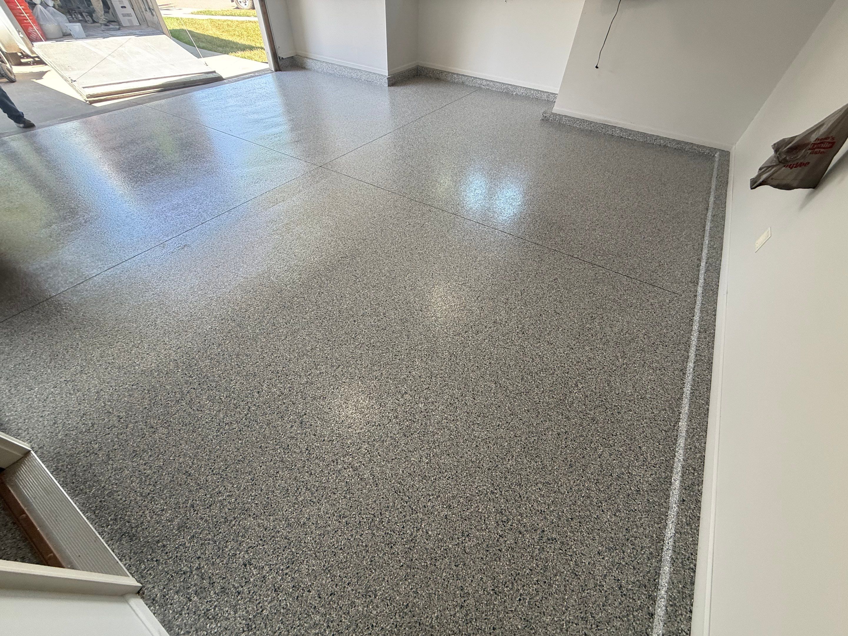 Decorative Chip Epoxy Floor Coating Installation in Sioux Falls by Select Painting, Coatings & Garage Cabinets