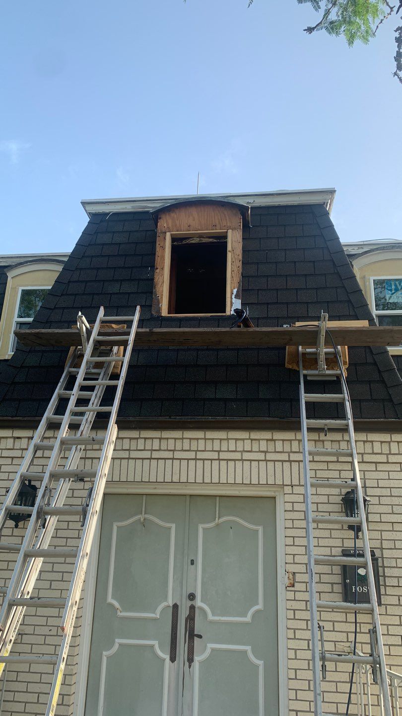 Mansard Charm by Bayfront Roofing and Construction