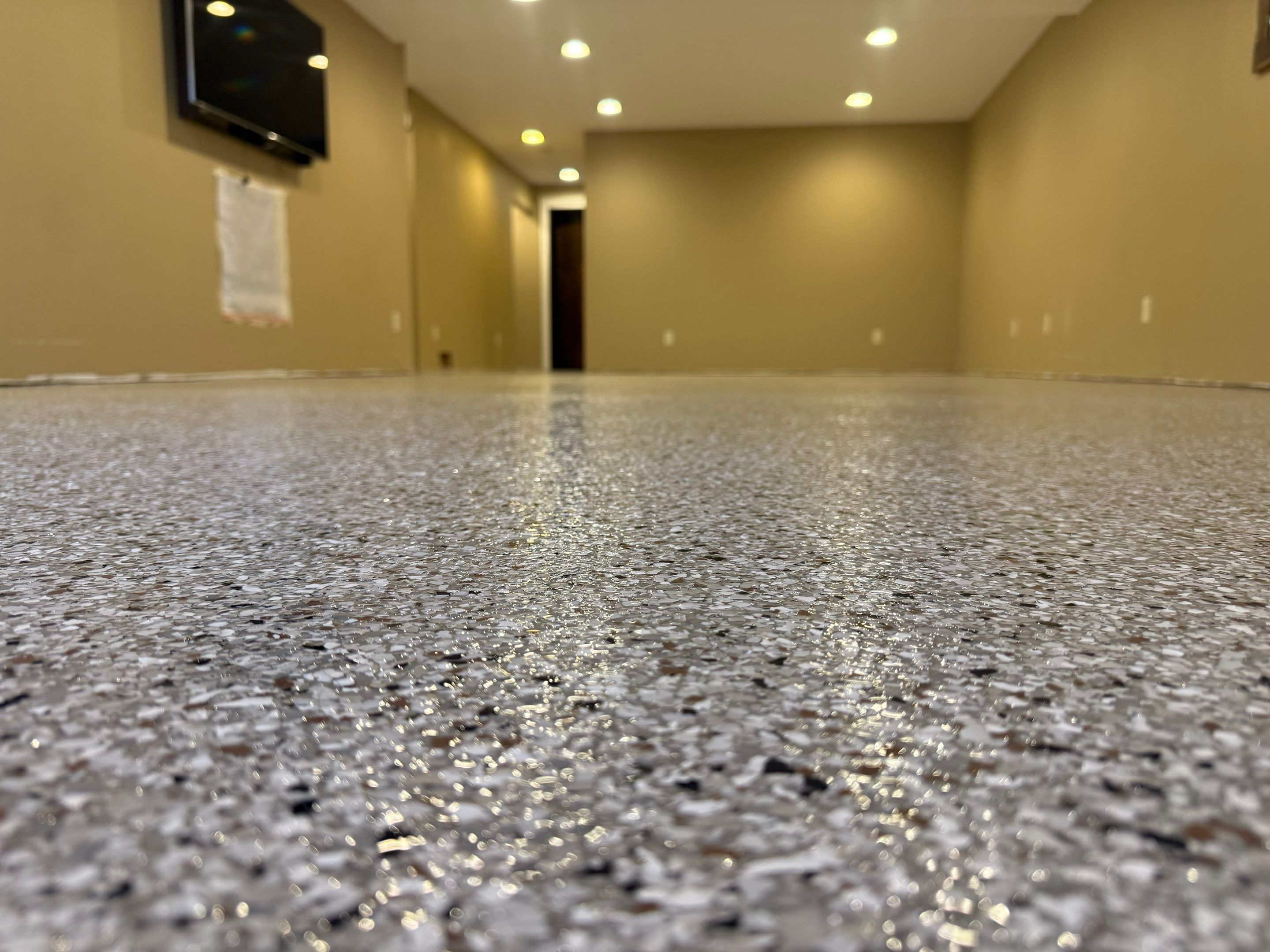 Decorative Flake Concrete Floor Coating for Larchwood Basement by Select Painting, Coatings & Garage Cabinets