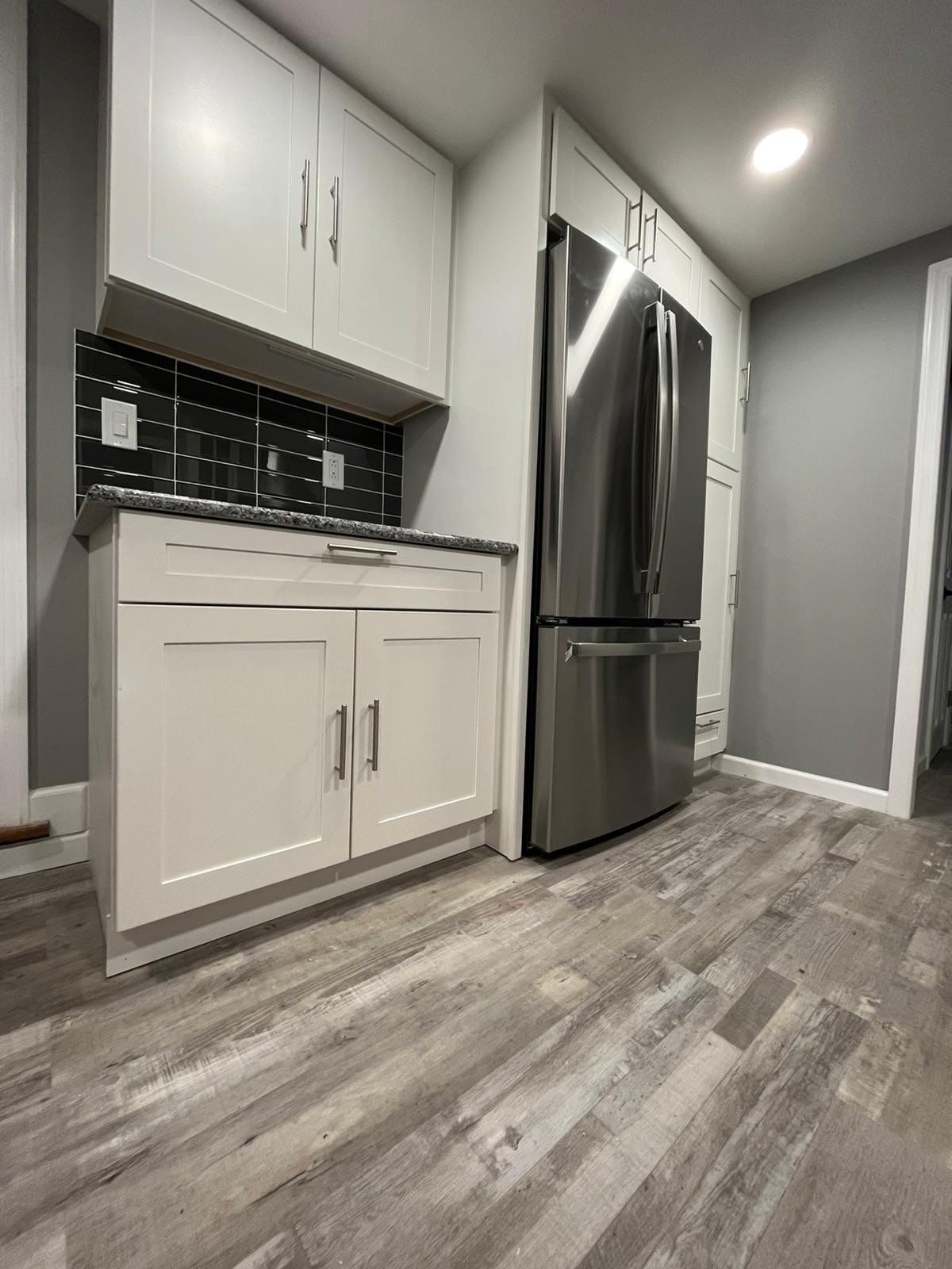 Kitchen Remodel using White Shaker by Home Concepts Construction